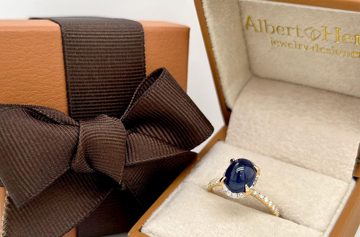 Be captivated by the elegance of this 18kt yellow gold ring, featuring an oval blue sapphire cabochon of 3.36 carats and 48 diamonds totaling 0.48 carats.

Size 6.5.