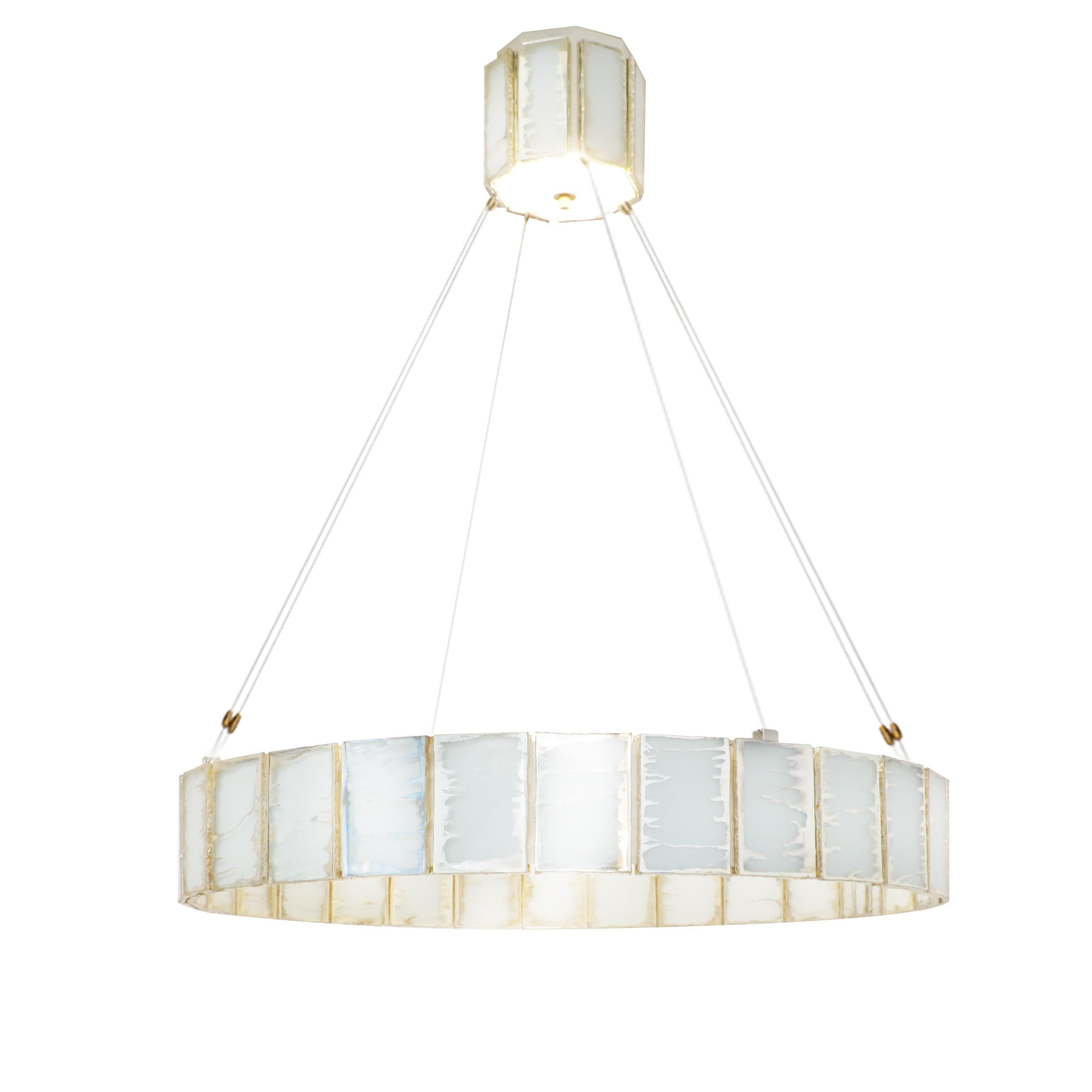 RING

Infinity, symbol of eternity
  
Welcome to the brilliant new Gem at home!
More than just a pendant lamp, Sabrina Landini’s Ring embodies a symbol of eternity while retaining all its modernity.
Expertly crafted in silvered glass slabs, like