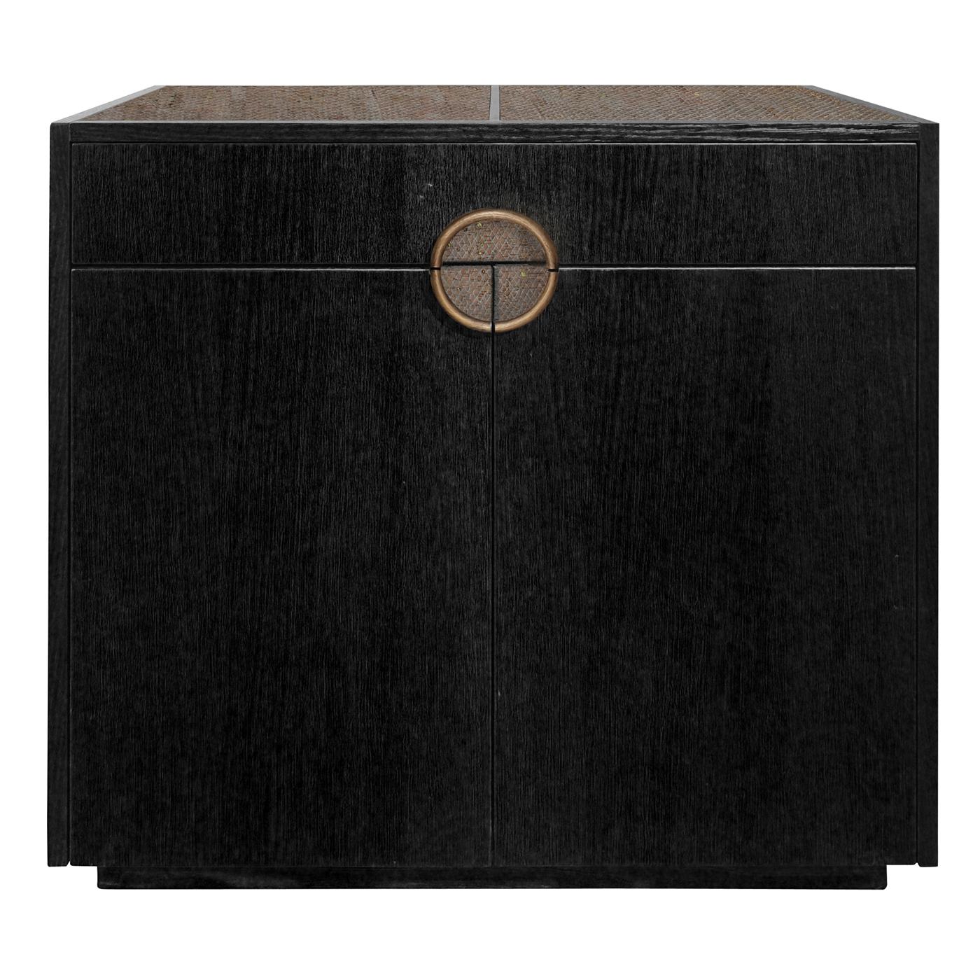 This sturdy yet elegant cabinet is an example of functional and refined craftsmanship. Fashioned of matte black stained oak, it comprises two doors and one top drawer. The ring-shaped handle and the top (divided into removable sections) are