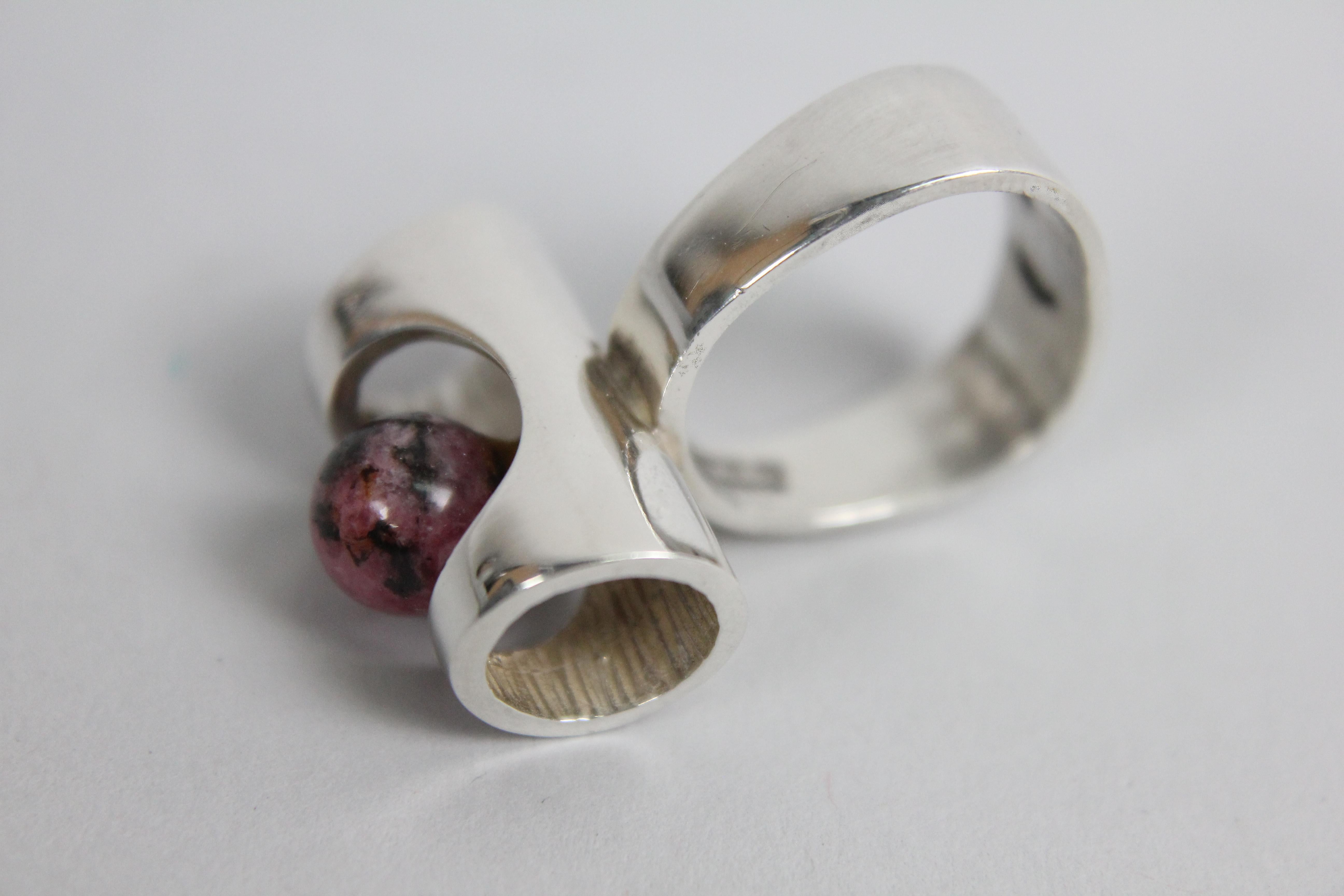 Modernist Ring by Henning Ulrichsen, Denmark 1960s. 
Sterling Silver and set with one Rhodonite stone.
Very good condition. No issues!
