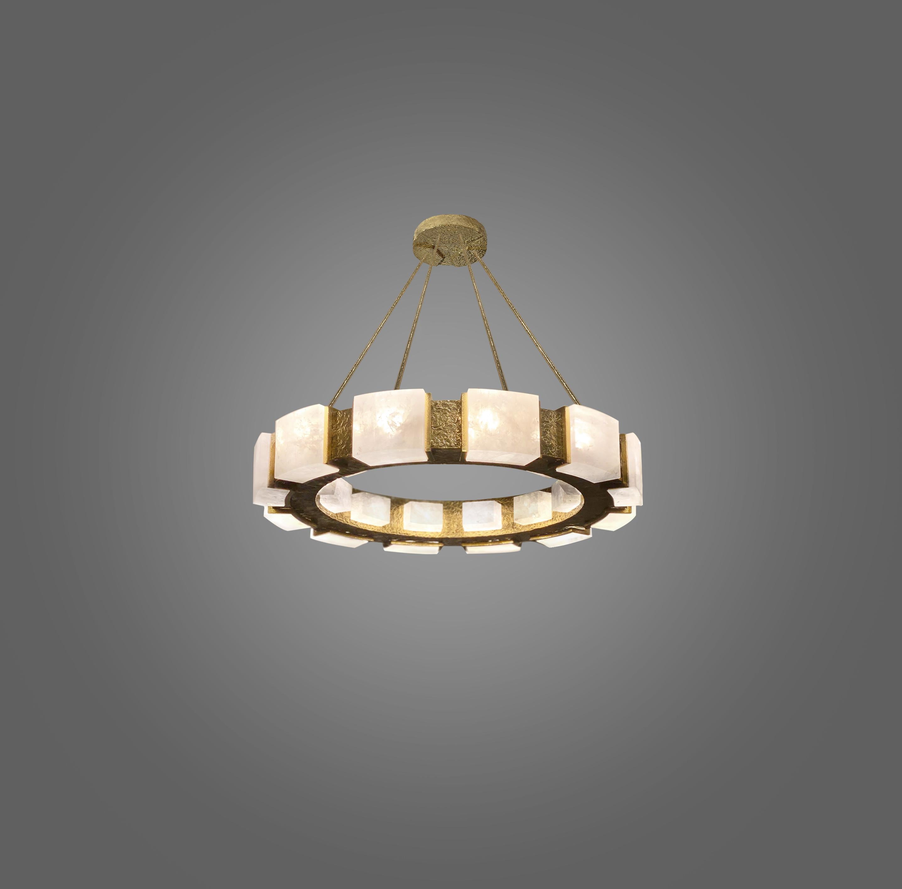 Rock crystal chandelier with hammered brass detail. Created by Phoenix Gallery, NYC.
12 sockets installed. Use 12 of G9 lightbulbs. 60watts each, total 720w max.
Custom size and finish upon request.