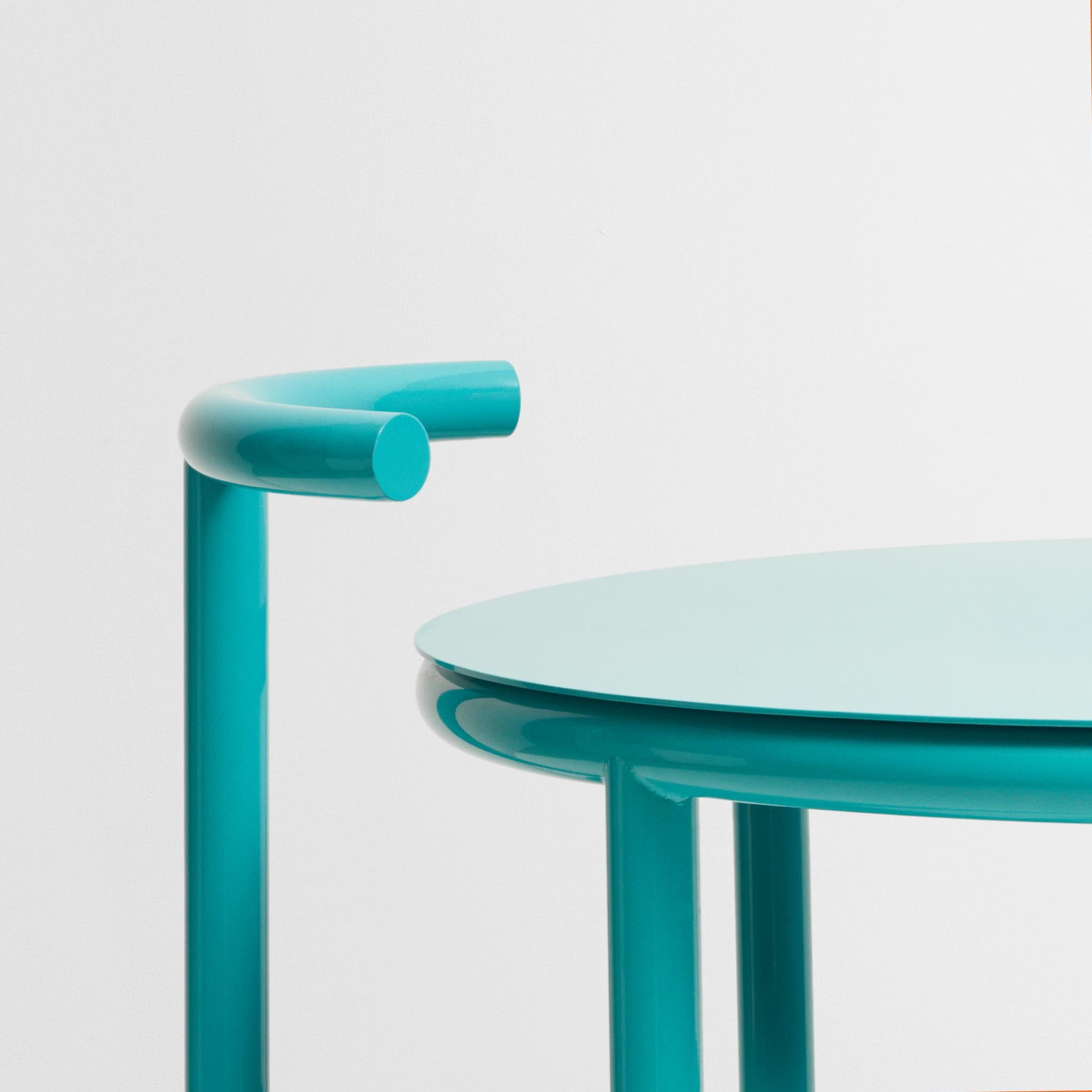 A cafe table originally designed to partner with the B Series chair.

The B - Series takes the graphical shapes found in the urban environment and reimagines them in to a bold statement pieces. With both post-modernist and modernist influences