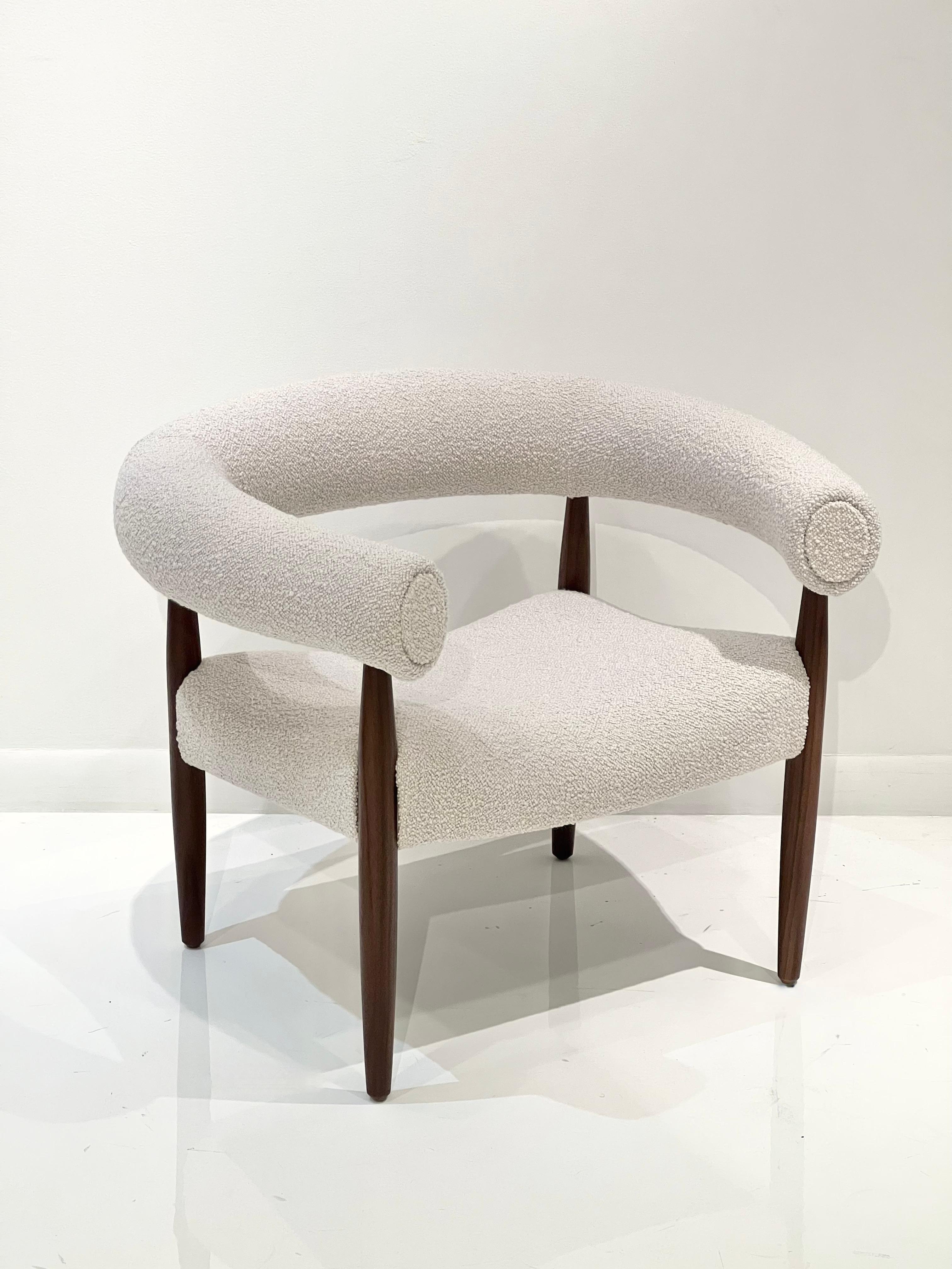 Ring chair in the style of Nanna Ditzel by Lost City Arts.
A wonderful and exceptionally comfortable lounge chair in the style of Nanna Ditzel. The original design is from 1958, Denmark. The upholstery is a light off-white fabric on a rich brown