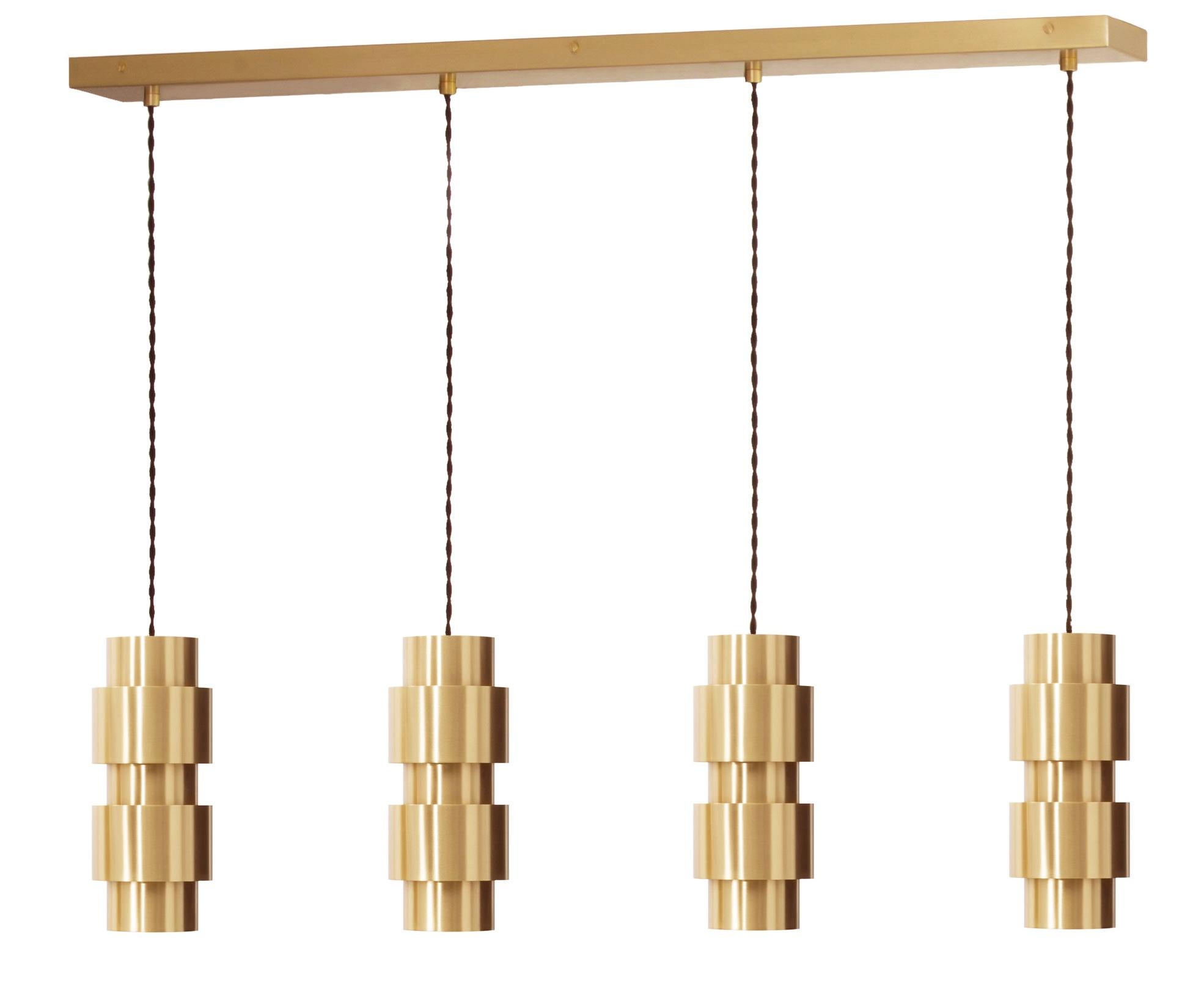 Ring Cluster Long 4 Pendants by CTO Lighting.
Materials: satin brass with black silk braided flex.
Also available in bronze and satin brass with black silk braided flex.
Dimensions: H 24 x W 90 cm.
Weight 10kg approx.
Other sizes are available.

All