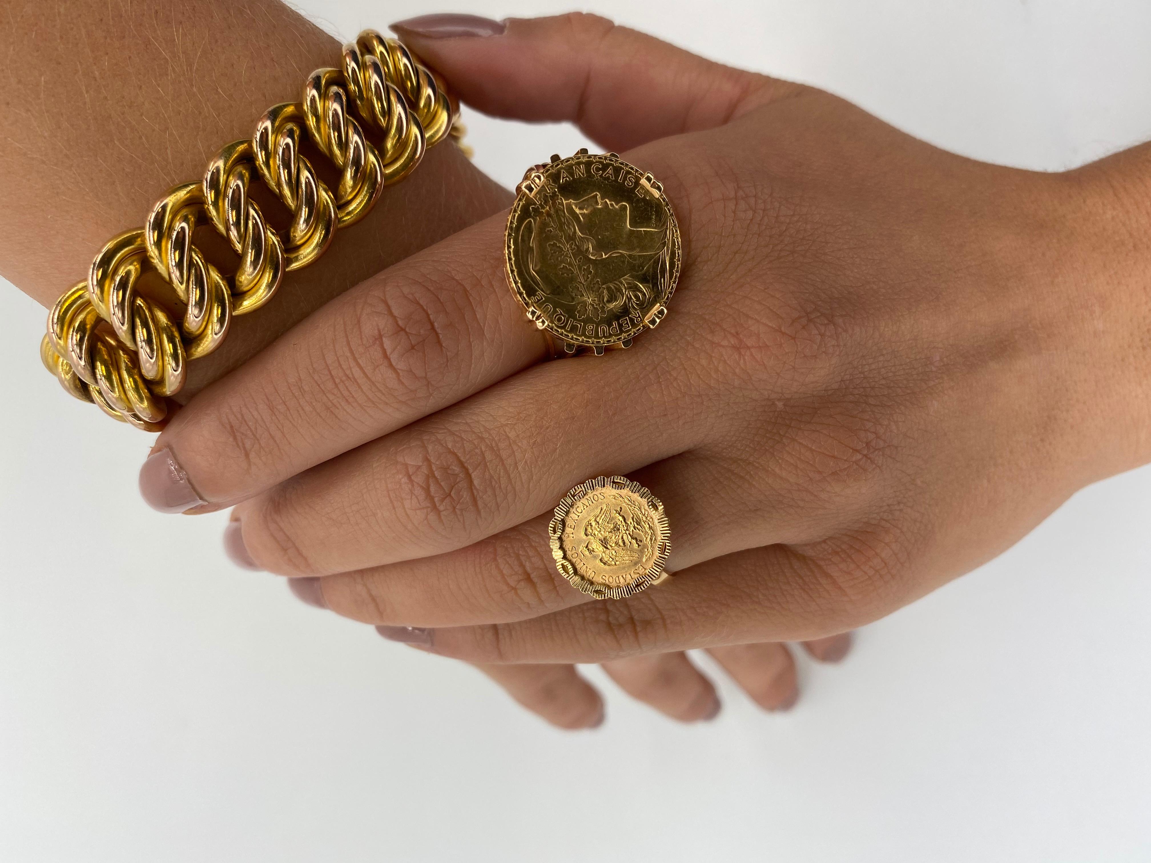 Discover this sumptuous Coin Ring in 18-carat Yellow Gold, showcasing a rare 20-franc coin in 24-carat Yellow Gold, enhanced by the graceful profile of Marianne, symbol of the French Republic. Marianne, wearing the famous Phrygian cap and crowned