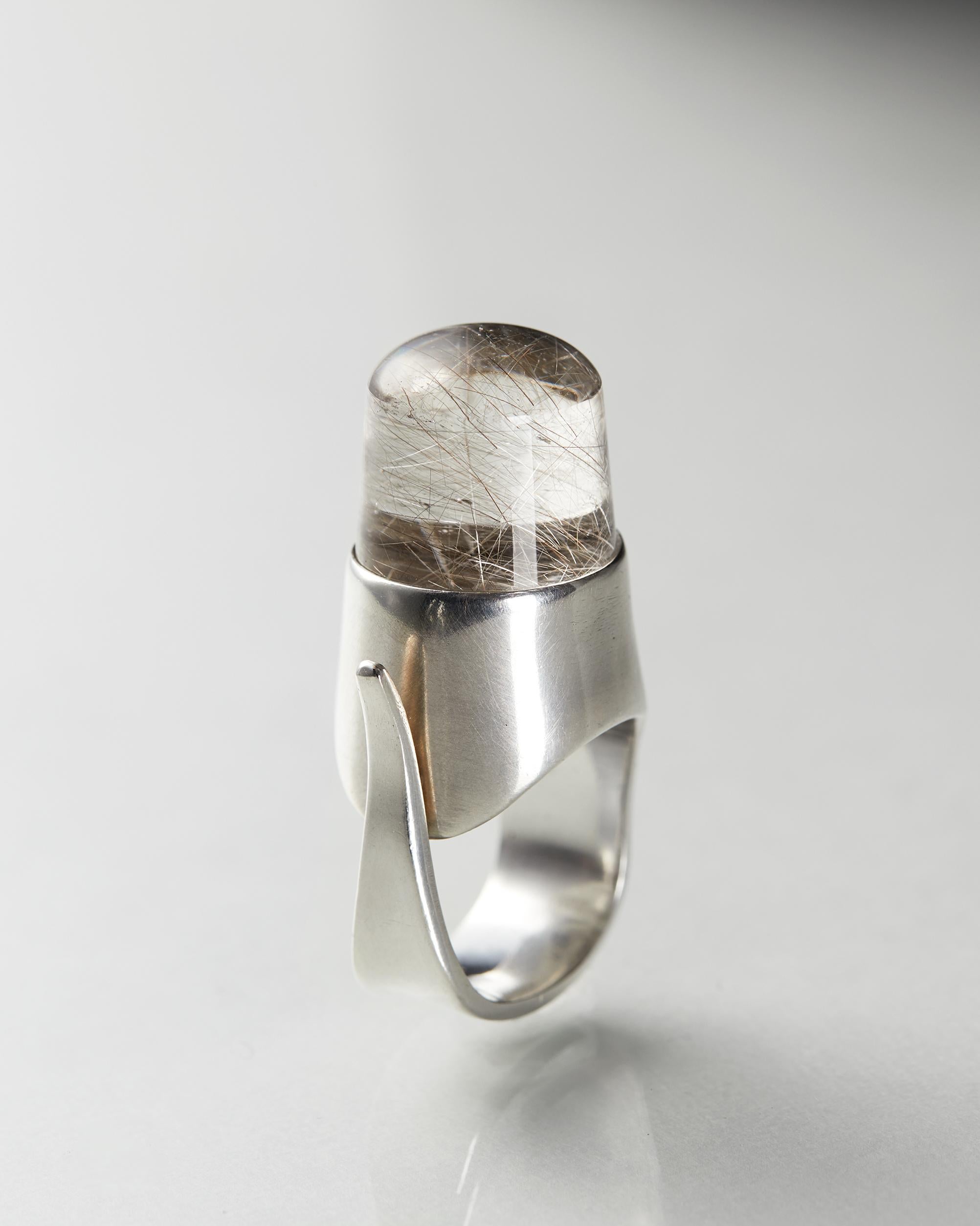 Sterling silver and rutile quartz.

Stamped: Georg Jensen, 925, no 151.

Size 5
