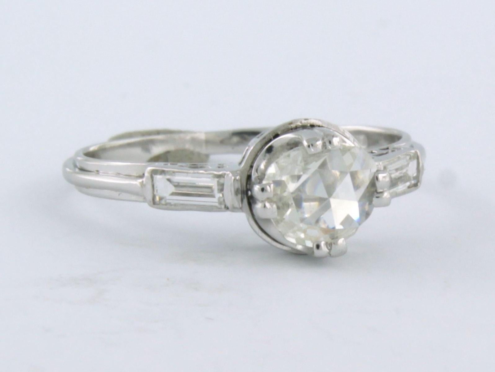 950pt platinum solitaire ring set with baguette cut and rose cut diamond tot. 0.70 ct - F/G - VS/SI - ring size 53

detailed description

the top of the ring is 7.0 mm wide

weight 2.9 grams

ring size 53, ring can be enlarged or reduced by a few