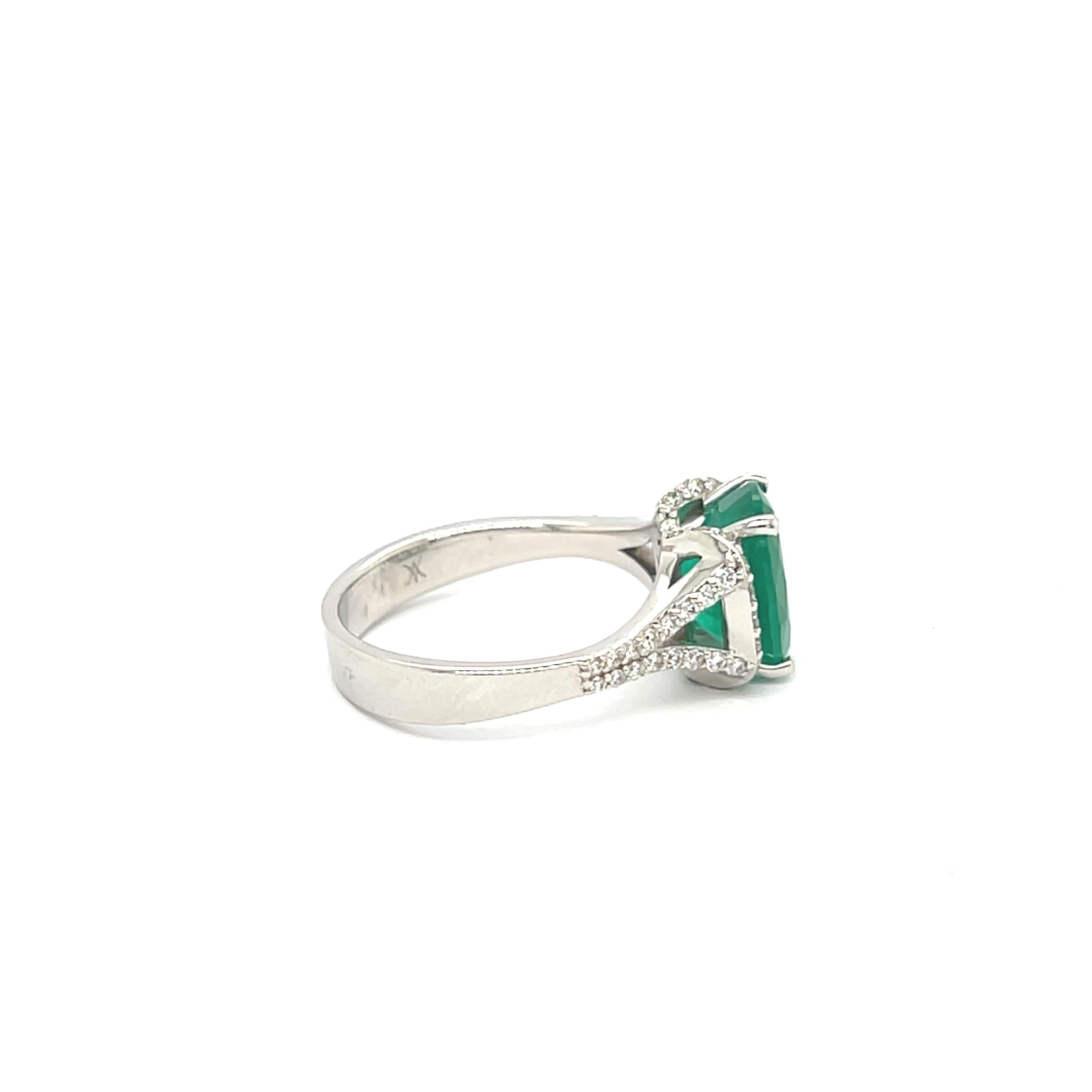 Emerald Ring 2.68 Carats Diamonds 0.36 Carats 18 Carat White Gold 

This superb 18-karat white gold ring is an exceptional piece of jewelry, showcasing a sumptuous 2.68-carat oval-cut emerald. Emerald, a deep, luminous green, is the focal point of
