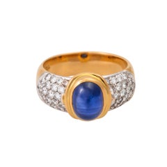 Ring, esp. with 1 oval sapphire cab. and 40 brilliance. together approx. 1.0 cts