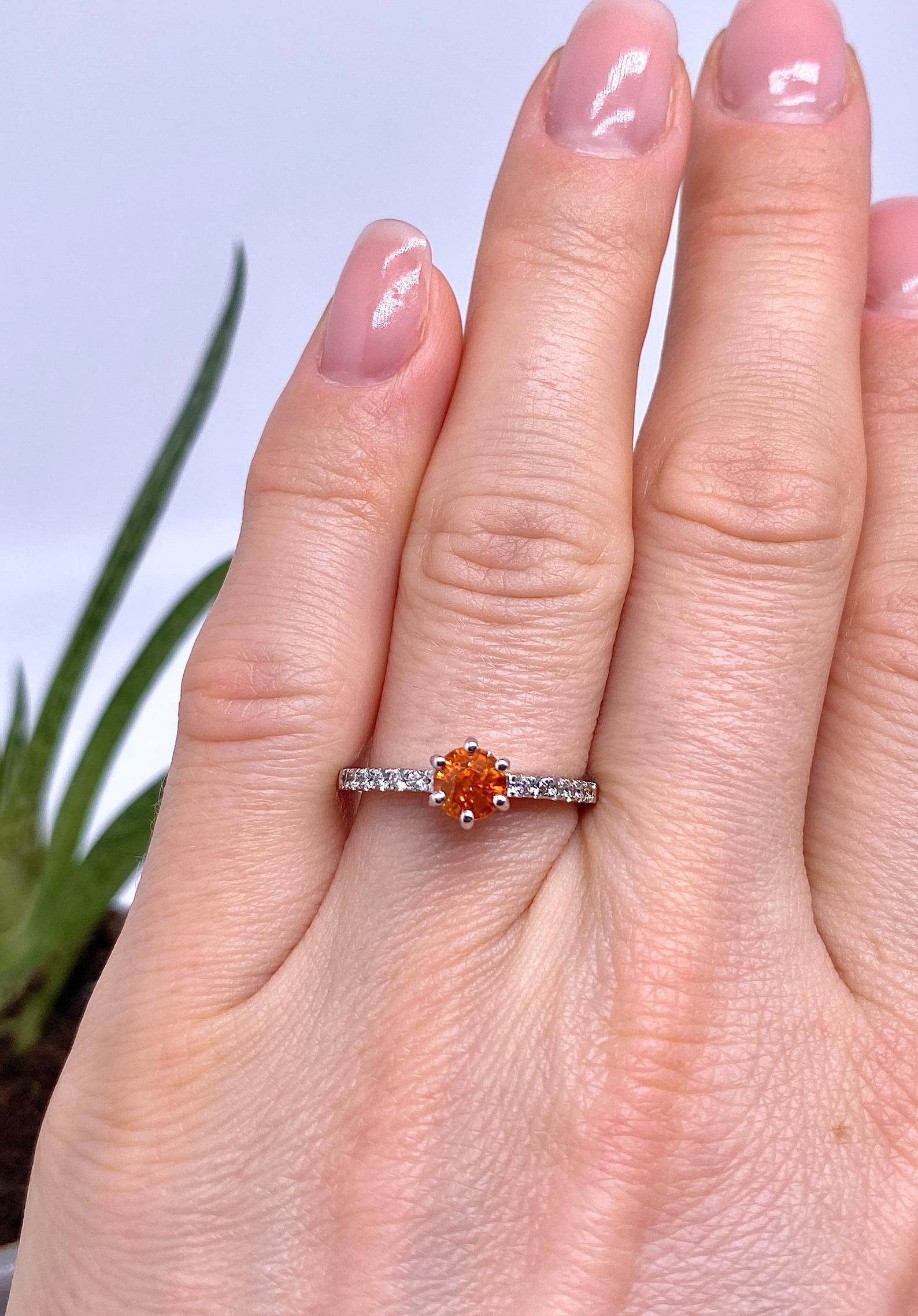 Natural Spessartine and Diamonds gemstone
14 Karat White Gold Ring

Laboratory full certificate for the ring.
Main Stone: Garnet Spessartine
Main Stone Creation: Natural
Main Stone Color: Orange
Main Stone Origin: Africa
Main stone size: 5.15x5.25mm