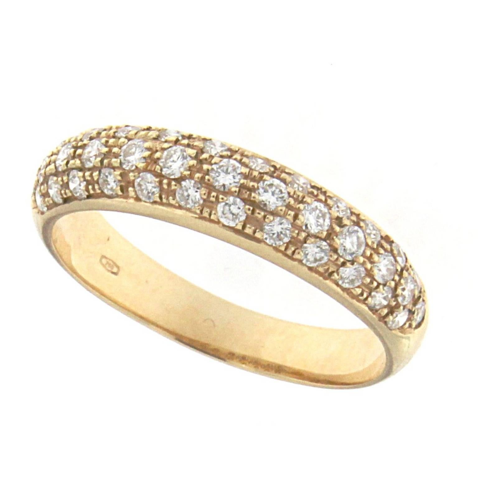Indulge in the elegance of the Essence Ring, crafted in 18 karat rose gold and adorned with brilliant white diamonds. This stunning piece offers a perfect blend of luxury and sophistication, making it a standout addition to any jewelry