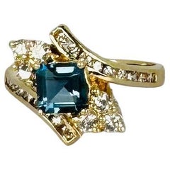 Ring yellow gold 14k with 0.48 carat diamonds and blue spinel of 1.28 carat