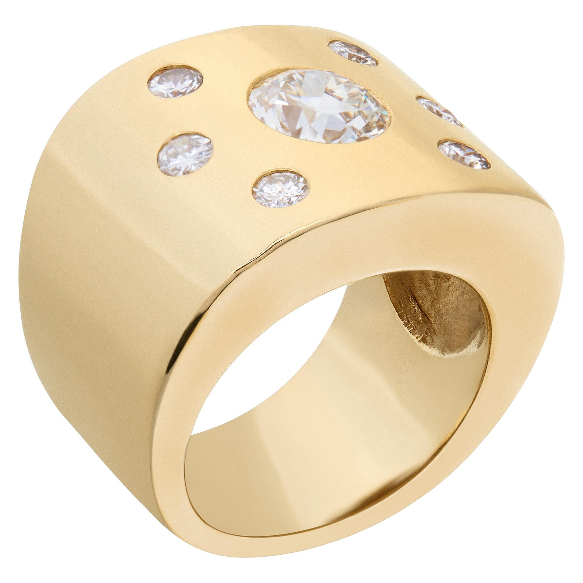 Impressive & wide diamond ring in 14k yellow gold. Center European cut diamond approximately 1 carat (J color, VS2 clarity) with 0.42 carats in side bezel set diamonds. Size 5.5. Width tempers from 16.3mm to 9.8mm. This Diamond ring is currently
