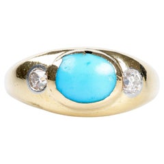 Ring in 18 carat yellow gold decorated with 2 diamonds and a turquoise