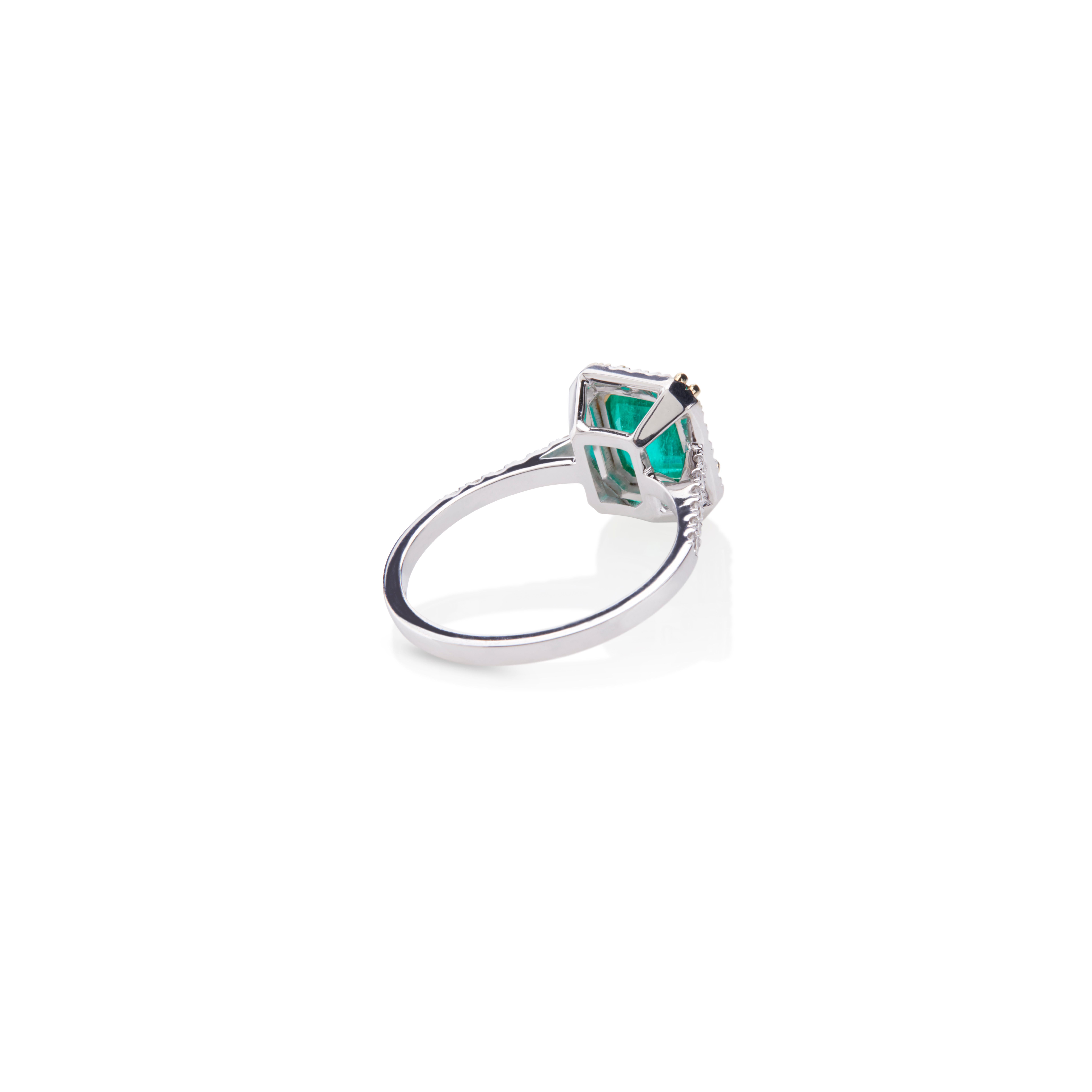 Contemporary Ring in 18Kt White Gold with 1.70ct Rare Green Emerald Cut Emerald and Diamonds  For Sale