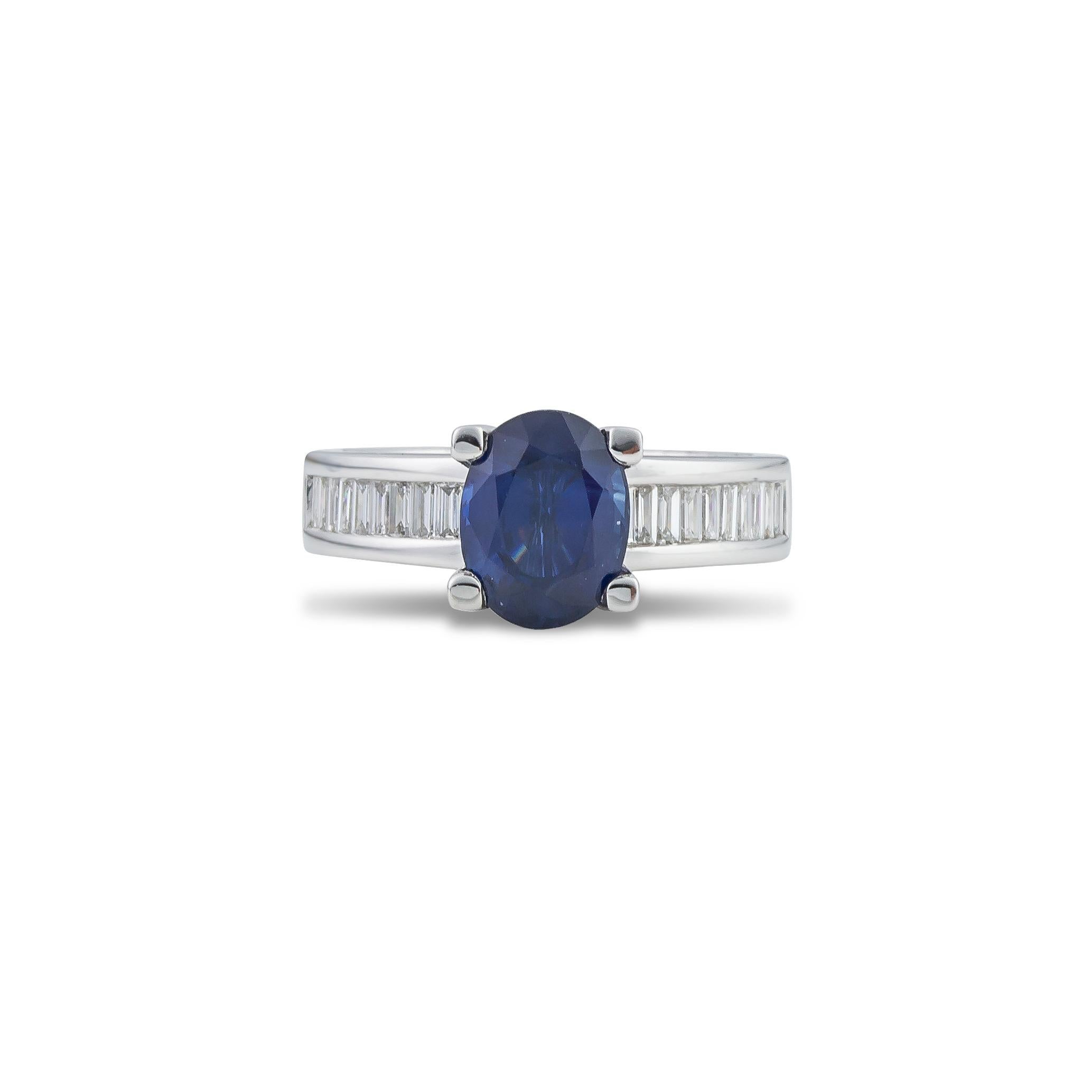 Contemporary Ring in 18Kt White Gold with 2.90 Ct Oval Blue Sapphire and Baguettes Diamonds For Sale