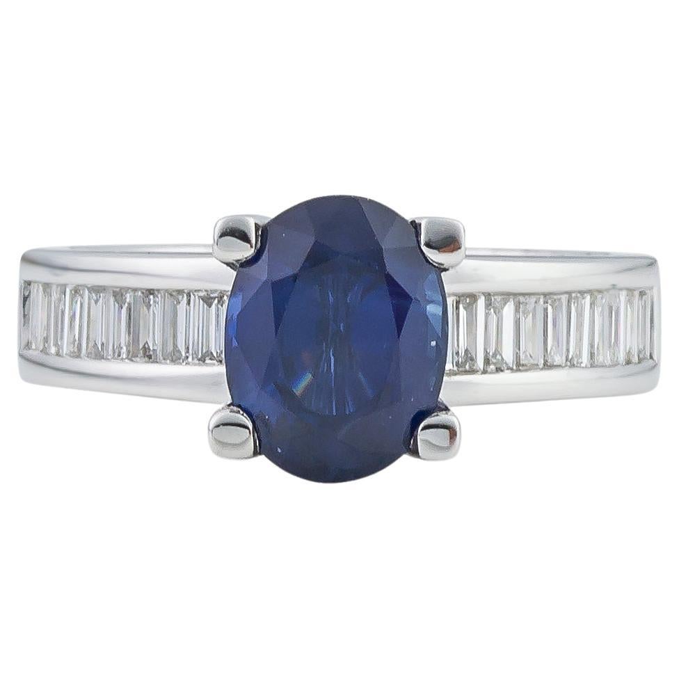 Ring in 18Kt White Gold with 2.90 Ct Oval Blue Sapphire and Baguettes Diamonds