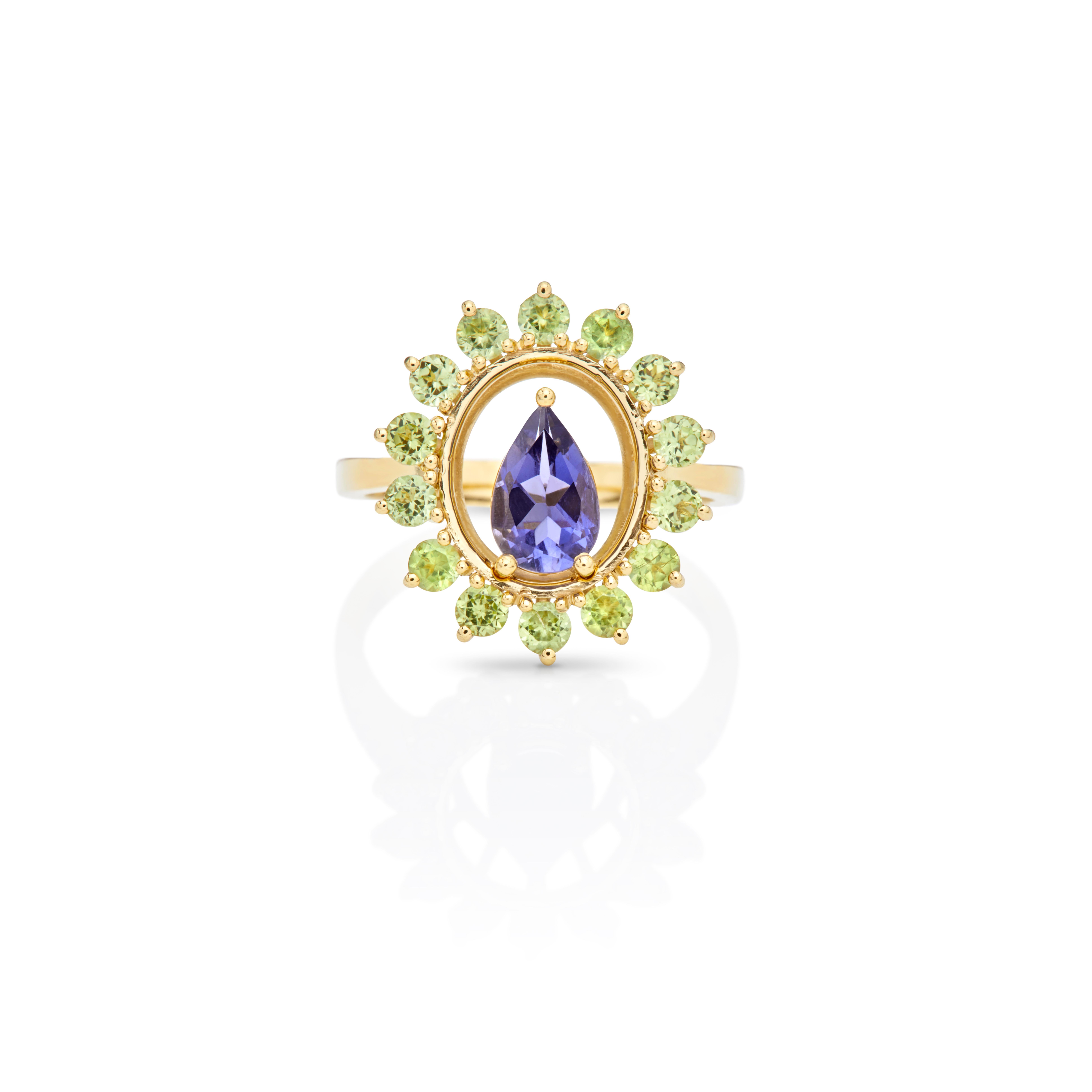 For Sale:  Ring in 18kt Yellow Gold  Pear Iolite Center and Round Cluster Peridot  Kallisto 3