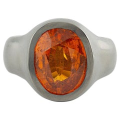 Ring in Hafnium with Oval Hessonite
