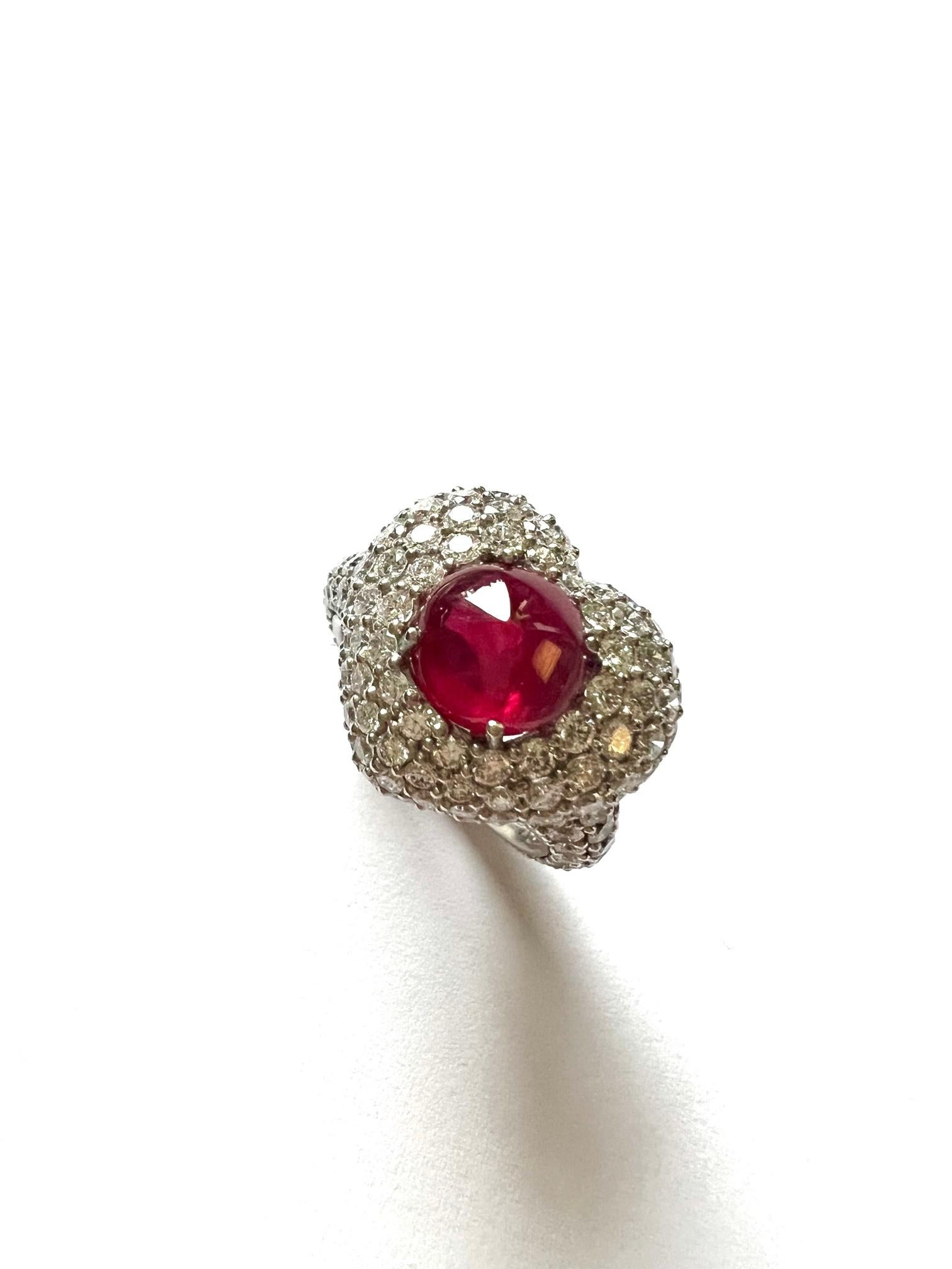 1 Ring in 950/ Platinum (14.45 gram), set with 1x Ruby (Sugarloaf cut, Burma GRS H(b), 3.11 carat) and 179x Diamonds (round, 1.1 - 2.0mm, 4.09 cts). 

Ringsize is 54 (6 3/4) and is resizable.
