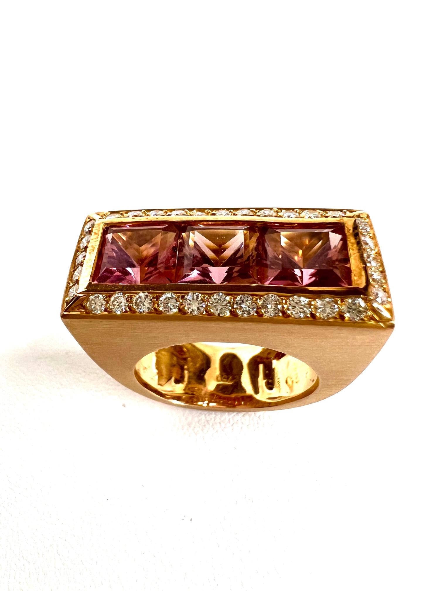 Thomas Leyser is renowned for his contemporary jewellery designs utilizing fine gemstones.

Ring in 18K red gold 13,9gr. with 3x Pink Tourmaline (princess-cut, 7x7mm, 7,5cts.) + 32x Diamonds (brillant-cut, 0,32 cts., G/VS).

Ringsize is 54,5 (7) and