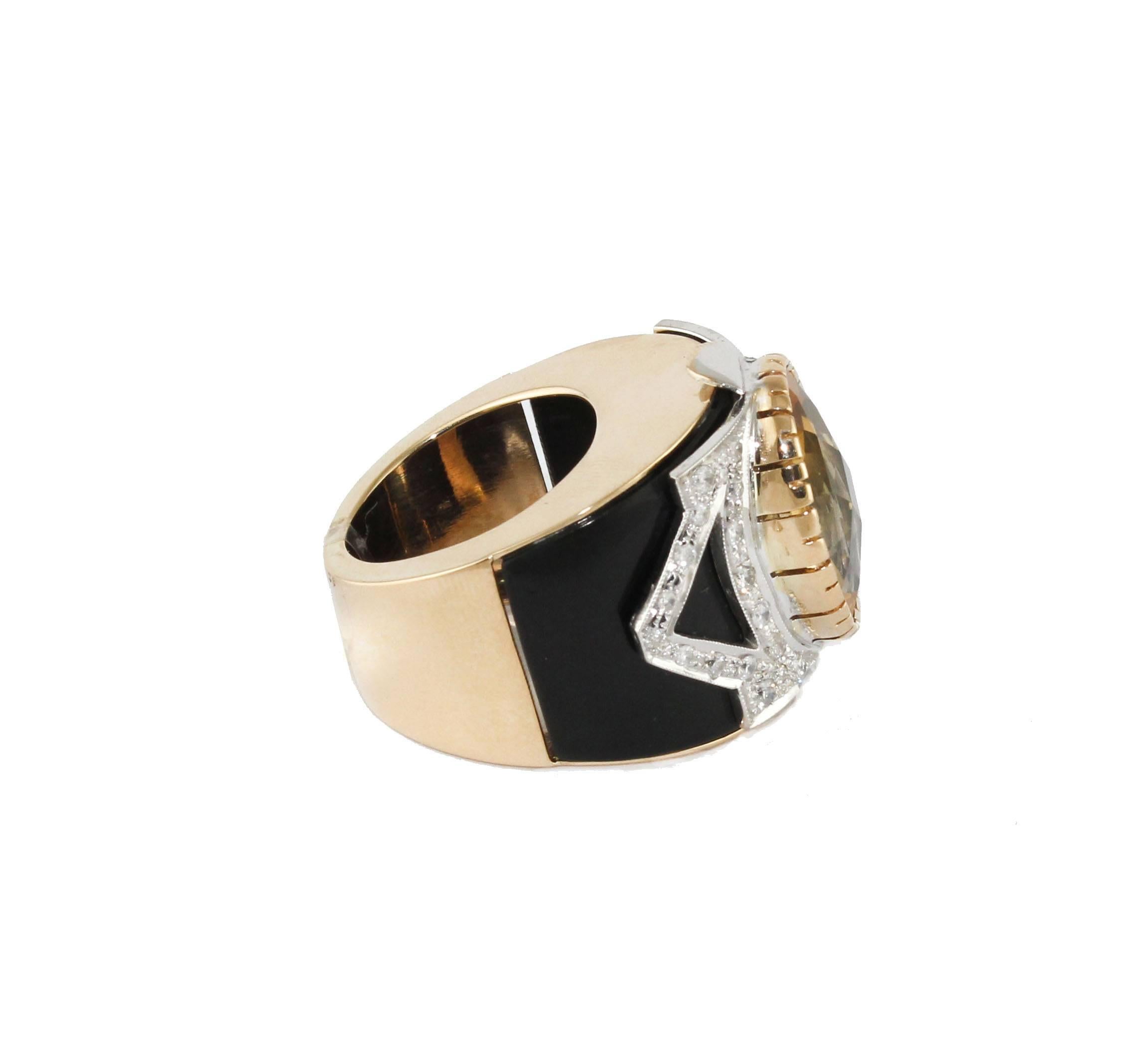 Beautiful 14 kt gold ring, with 0.81 ct diamonds, 2.20 g Onyx band and a fantastic topaz ct 9.70, total weight 16.30 g.
Diamonds ct 0.81
Onyx gr 2.20
Topaz ct 9.70
Size ita 13.50
Size franc 53.50 
Size uses 6,67
Total weight g 16.30
R.F ++ fear