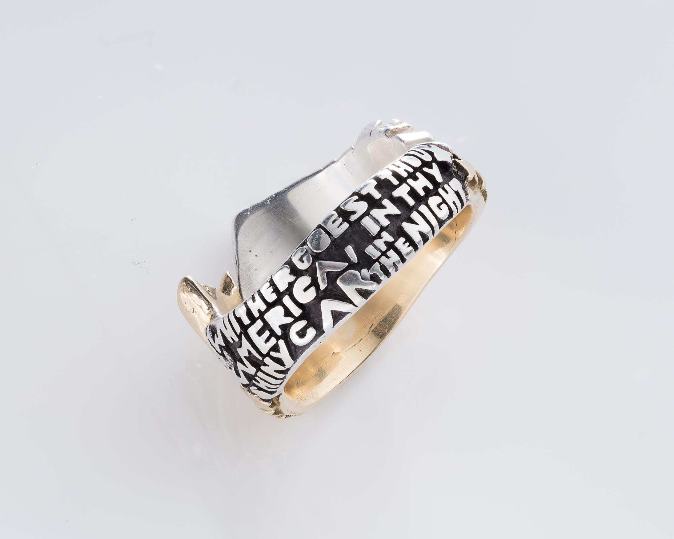 Untitled ring in sterling silver, 18-karat gold, rubies, and sapphires. Includes the following text carved on the verso of the ring band: 