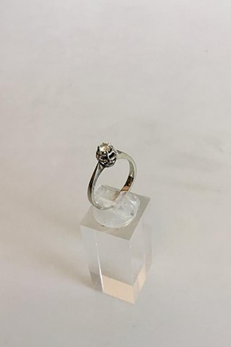 Ring in White Gold with Brilliant in 0.2 carat. 18 K. Ring size 56 / US 7 1/2. Weighs 2.84 g / 0.10 oz. Stamped 750