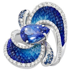 Bague en or blanc avec diamants, tanzanite, saphir bleu et micromosaïque
