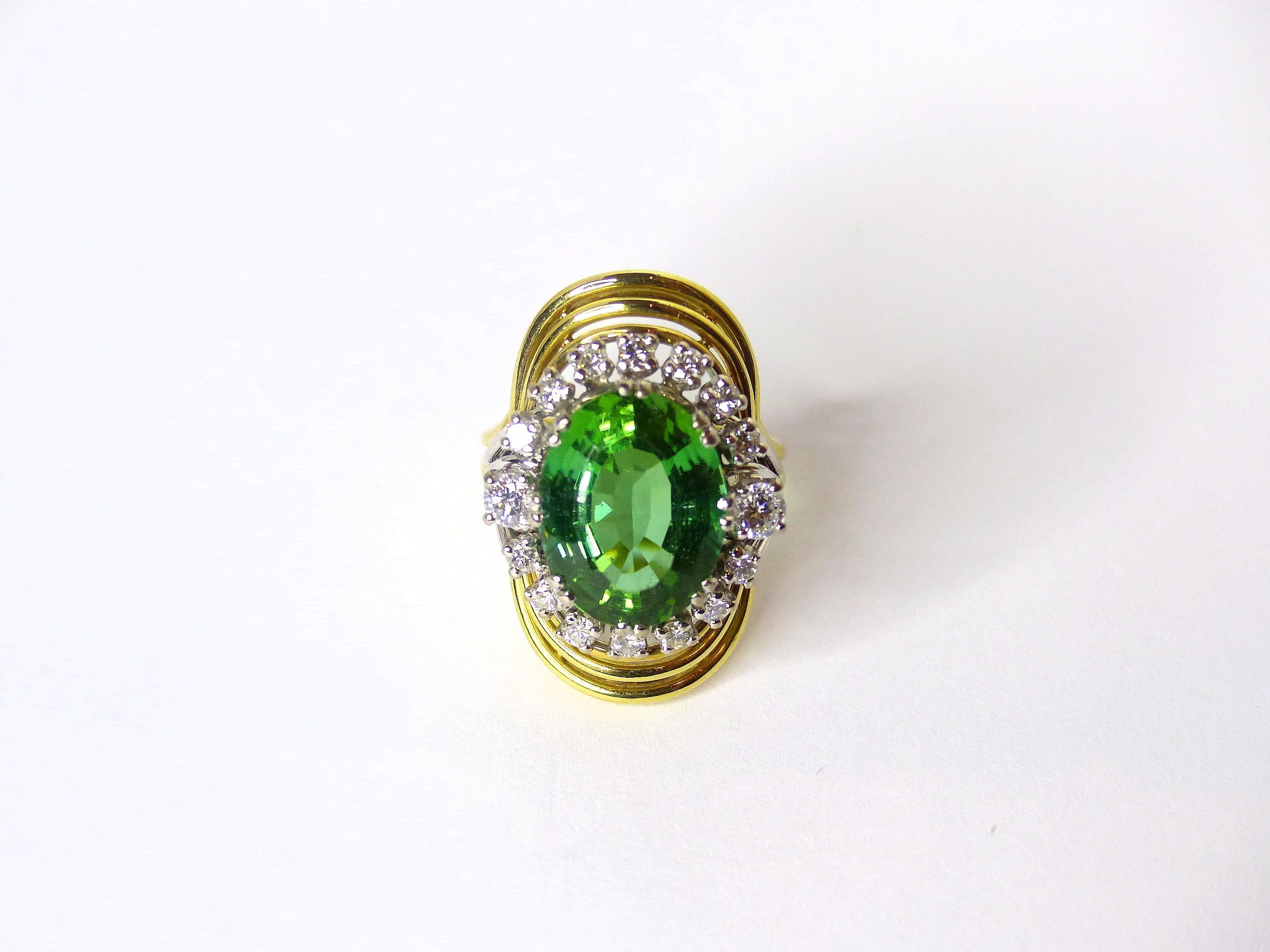 Thomas Leyser is renowned for his contemporary jewellery designs utilizing fine gemstones.

This 14k yellow gold ring 10,74gr. is set with 1 top quality Tourmaline in magnificient colour with Namibia origin, oval 15x11mm, 8,21ct. and 16 Diamonds