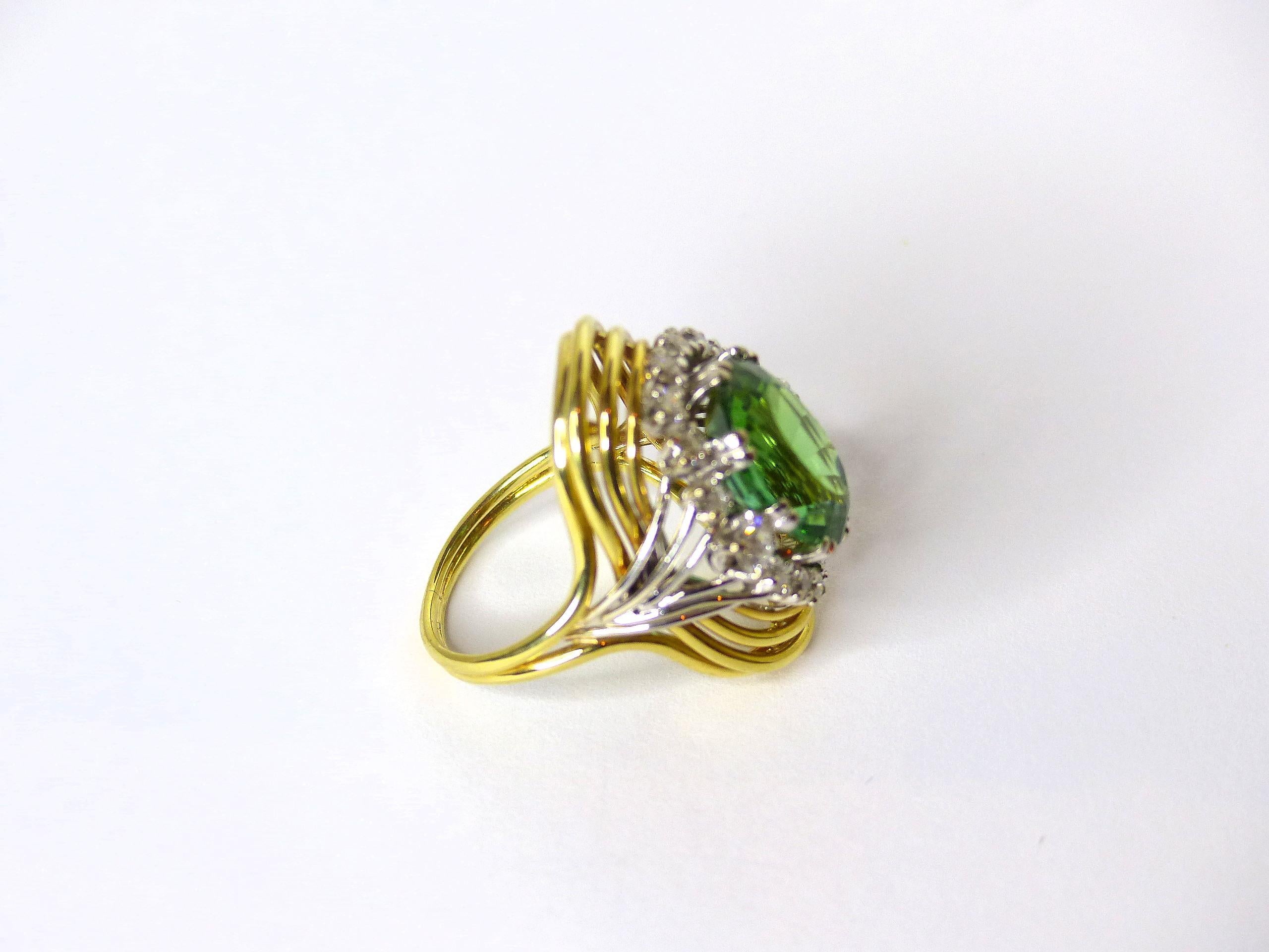 Oval Cut Ring in Yellow Gold with 1 green Tourmaline and Diamonds