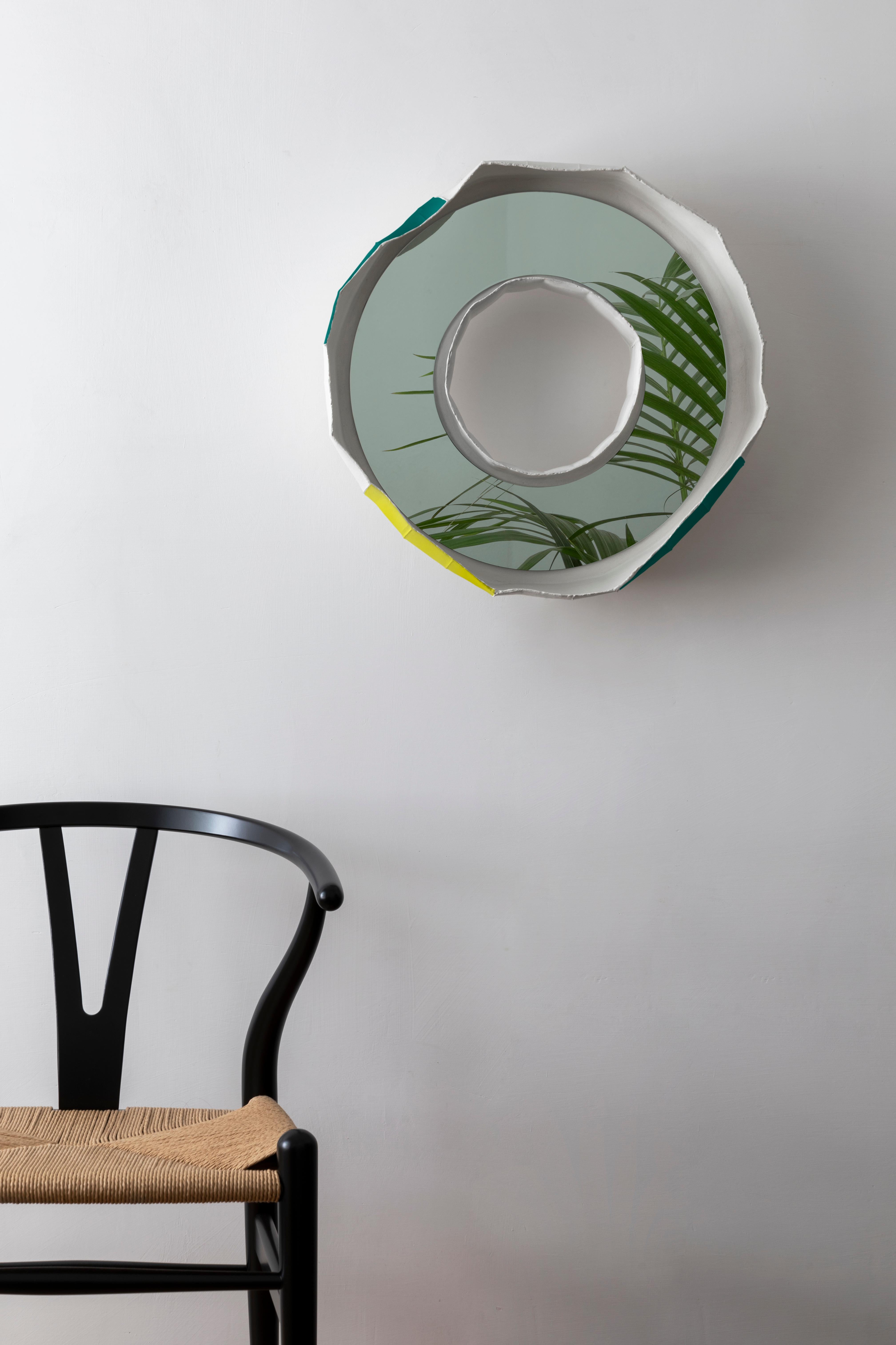 RING NOVA, a stunning ceramic mirror handmade in Italy, one of 2 designs that make up the collection REFLECTIONS, the result of a collaboration between artist Paola Paronetto & designer Giovanni Botticelli, that integrates ceramic with colour and