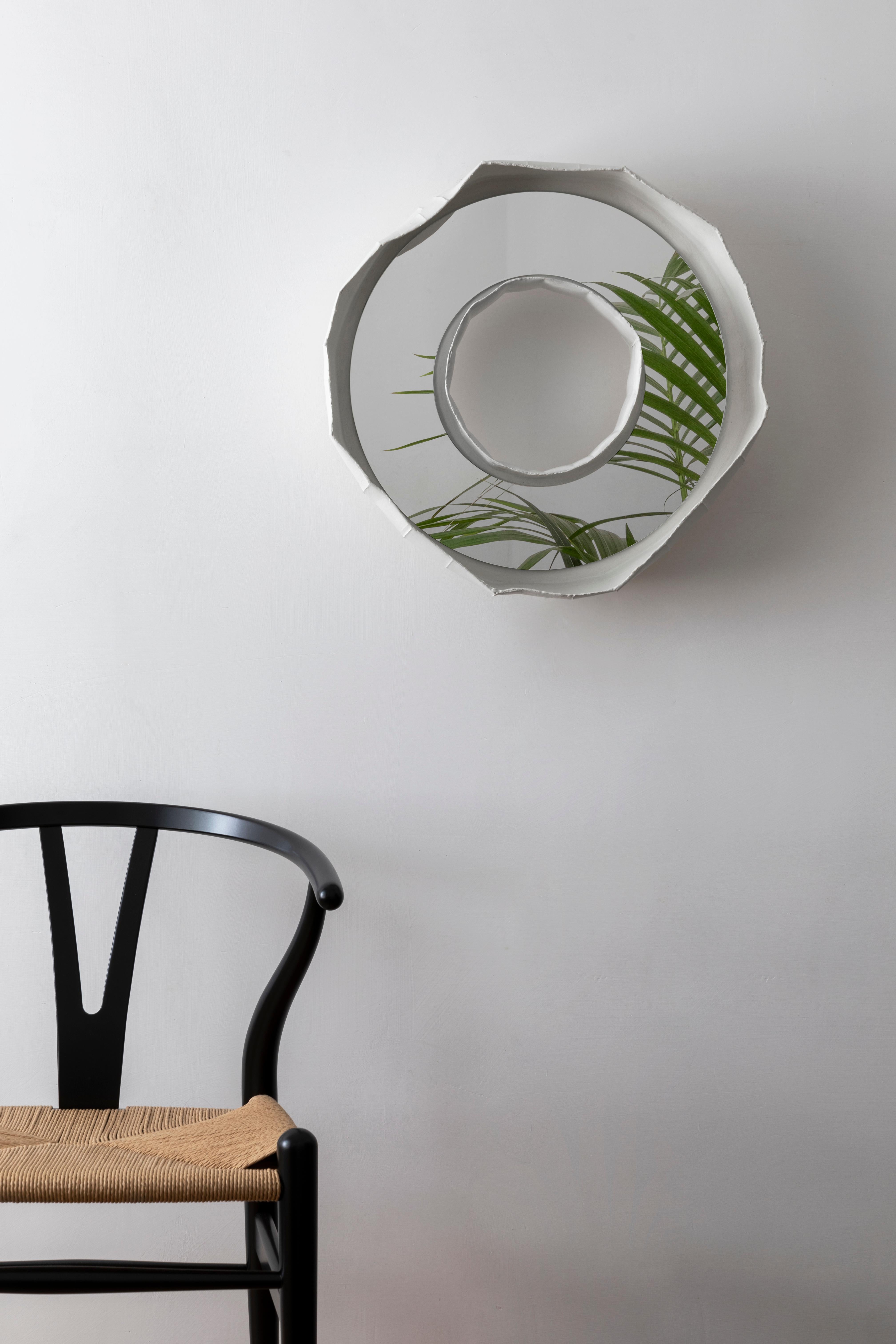RING NOVA, a stunning ceramic mirror handmade in Italy, one of 2 designs that make up the collection REFLECTIONS, the result of a collaboration between artist Paola Paronetto & designer Giovanni Botticelli, that integrates ceramic with colour and