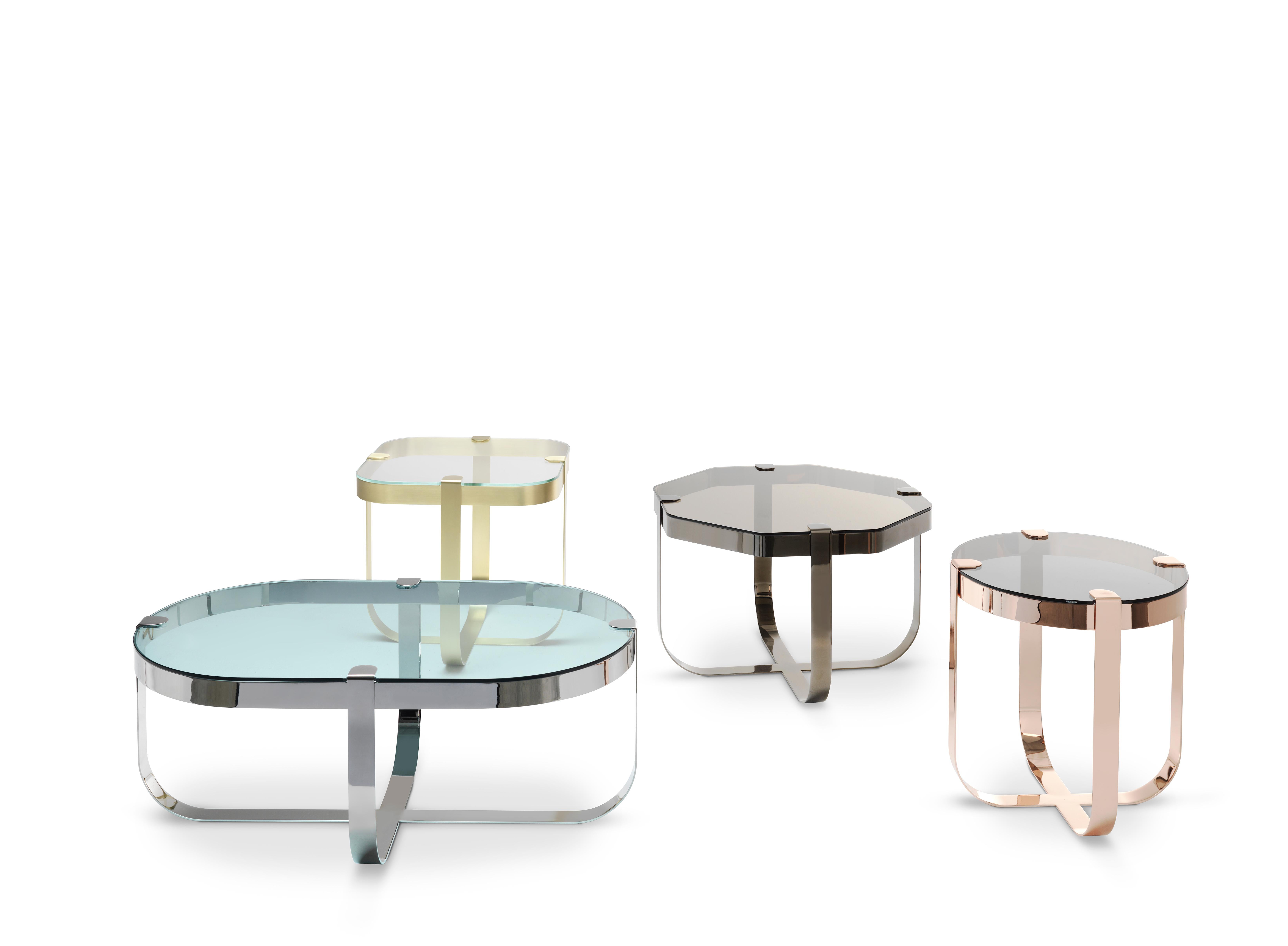 Elegant like jewellery, the Ring coffee tables are inspired by raw cuts of precious stones prior to being mounted into rings. The choice of materials is aimed to emphasise this inspiration behind the collection. The metal base structures are