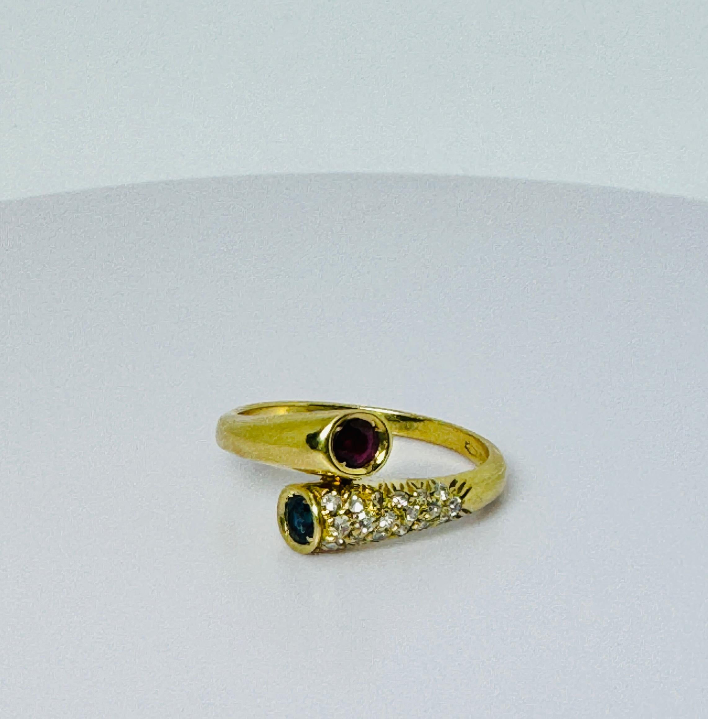 Ring of 18 carat yellow with a ruby, a blue sapphire and brilliant cut diamonds For Sale 1
