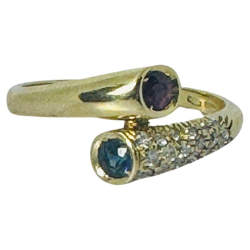 Ring of 18 carat yellow with a ruby, a blue sapphire and brilliant cut diamonds For Sale