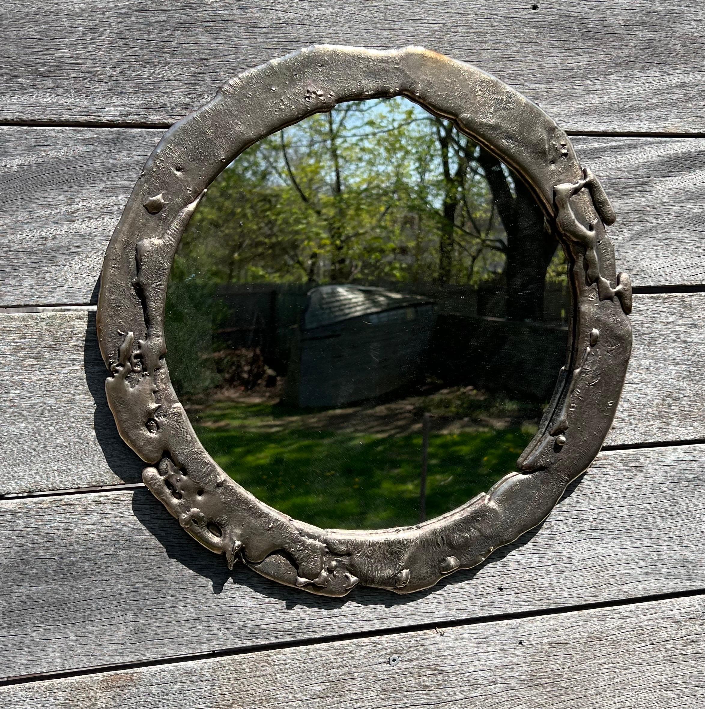 Poured silicon bronze mirror.