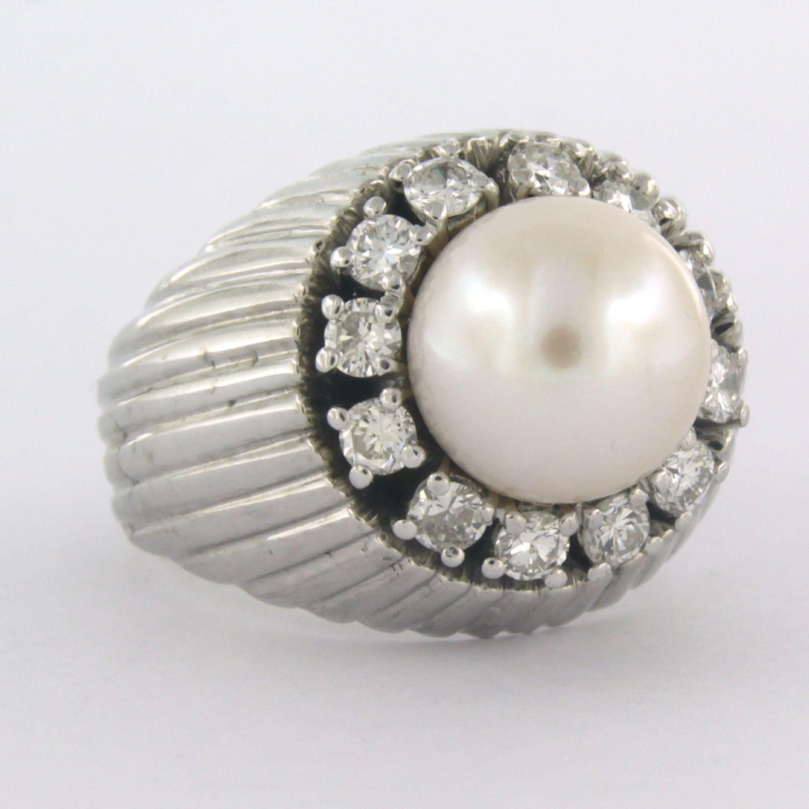18 kt white gold ring set with pearl ​​and brilliant cut diamond 0.50 ct F/G SI - ring size 54

detailed description

The top of the ring is 1.7 cm wide and 1.5 cm high

weight 14.5 grams

ring size 54, the ring can be enlarged or reduced a few