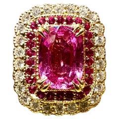 Ring Pink sapphire 1.31 carat surrounded by pavé diamonds and pink sapph