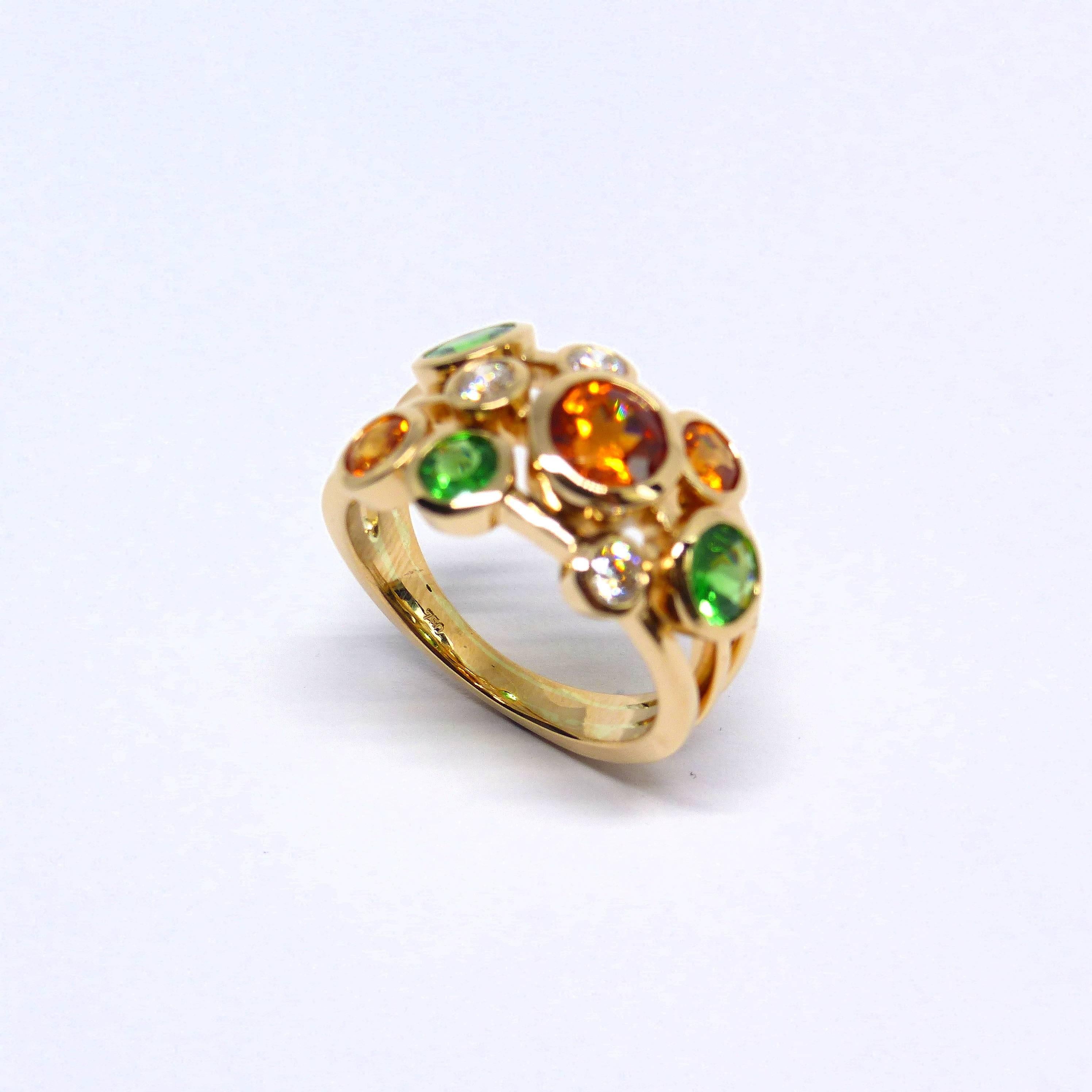 Thomas Leyser is renowned for his contemporary jewellery designs utilizing fine gemstones. 

This 18k rose gold ring 8,75gr. with 3 Mandarine Garnet round 4-6mm, 1,47cts. + 3 Tsavolites round 4-5mm, 1,21cts. + 3 diamonds brillant cut 3mm, 0,31cts.