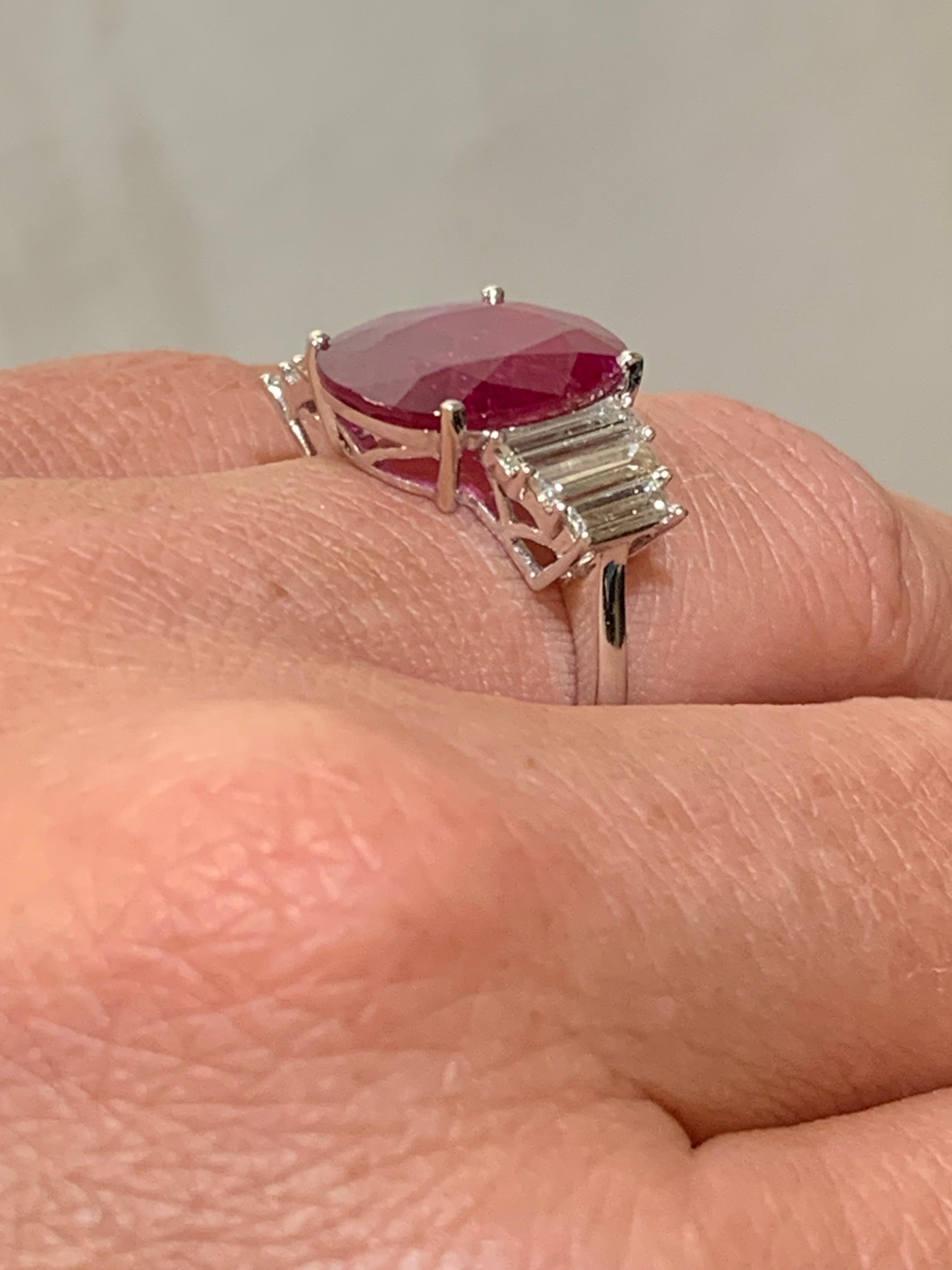 Women's Ring Set with a Ruby Surrounded by Baguette Cut Diamonds