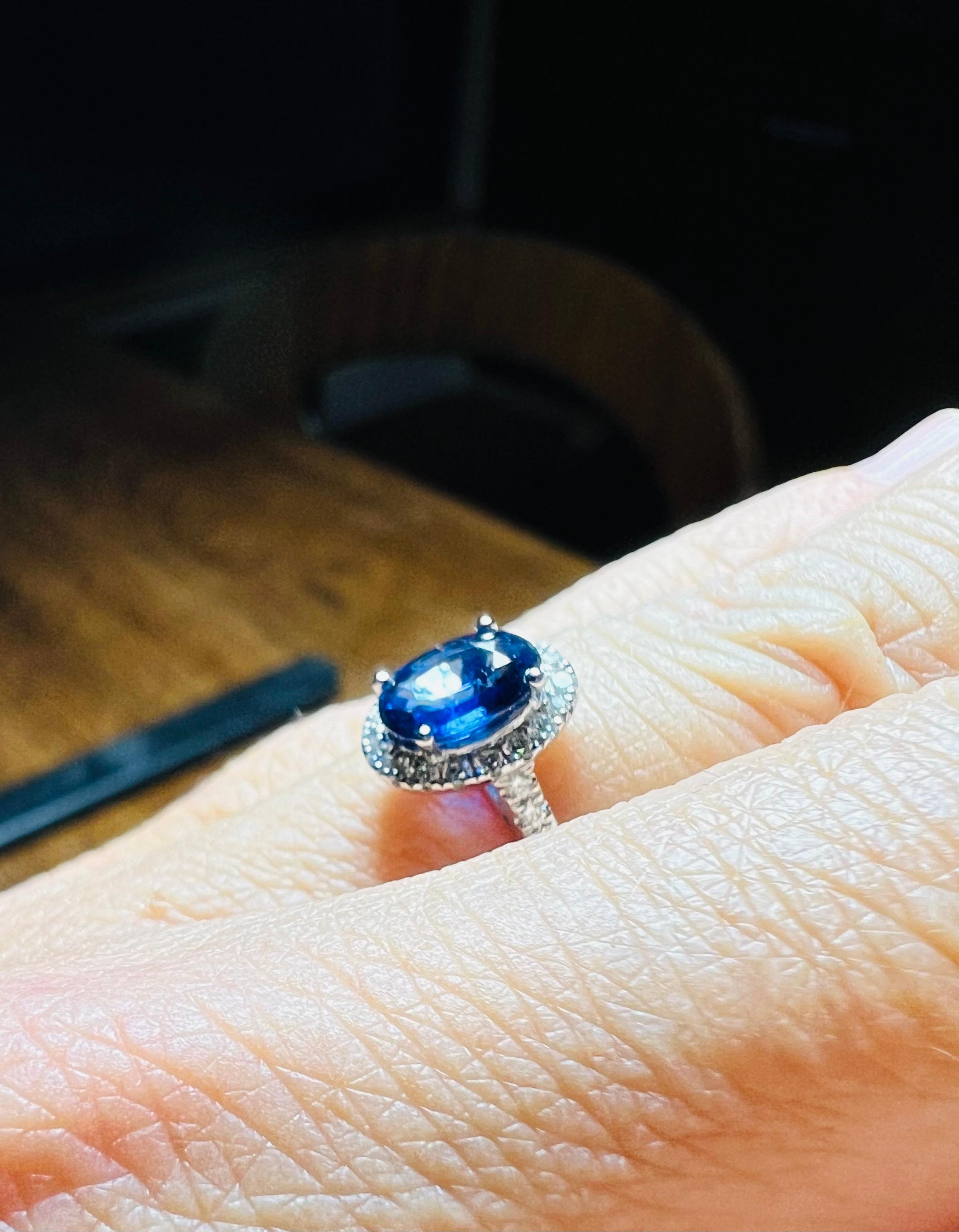 Ring Set With A Sapphire Surrounded By Diamonds, 18 Carat Gold 8