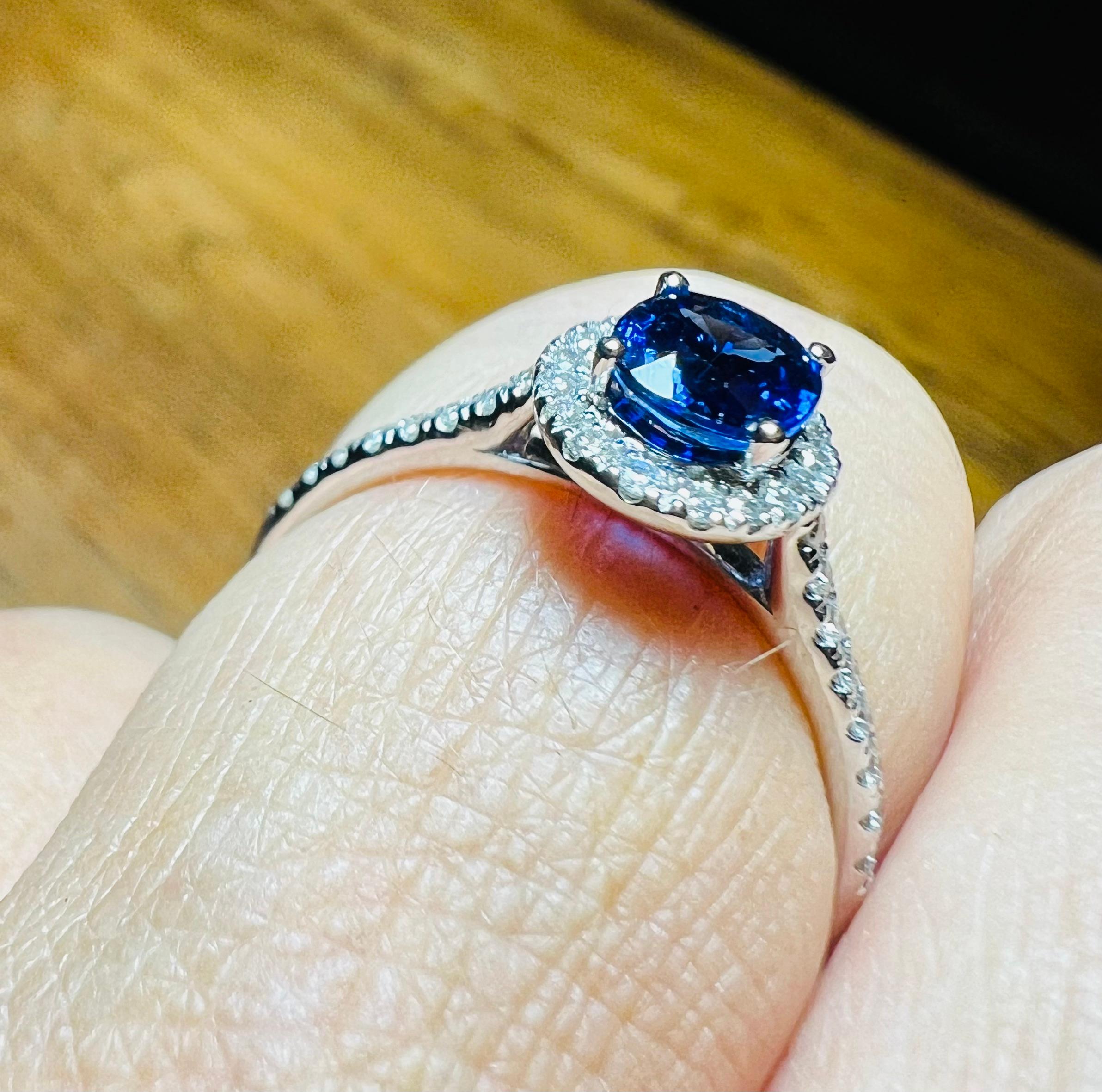 Oval Cut Ring Set With A Sapphire Surrounded By Diamonds, 18 Carat Gold