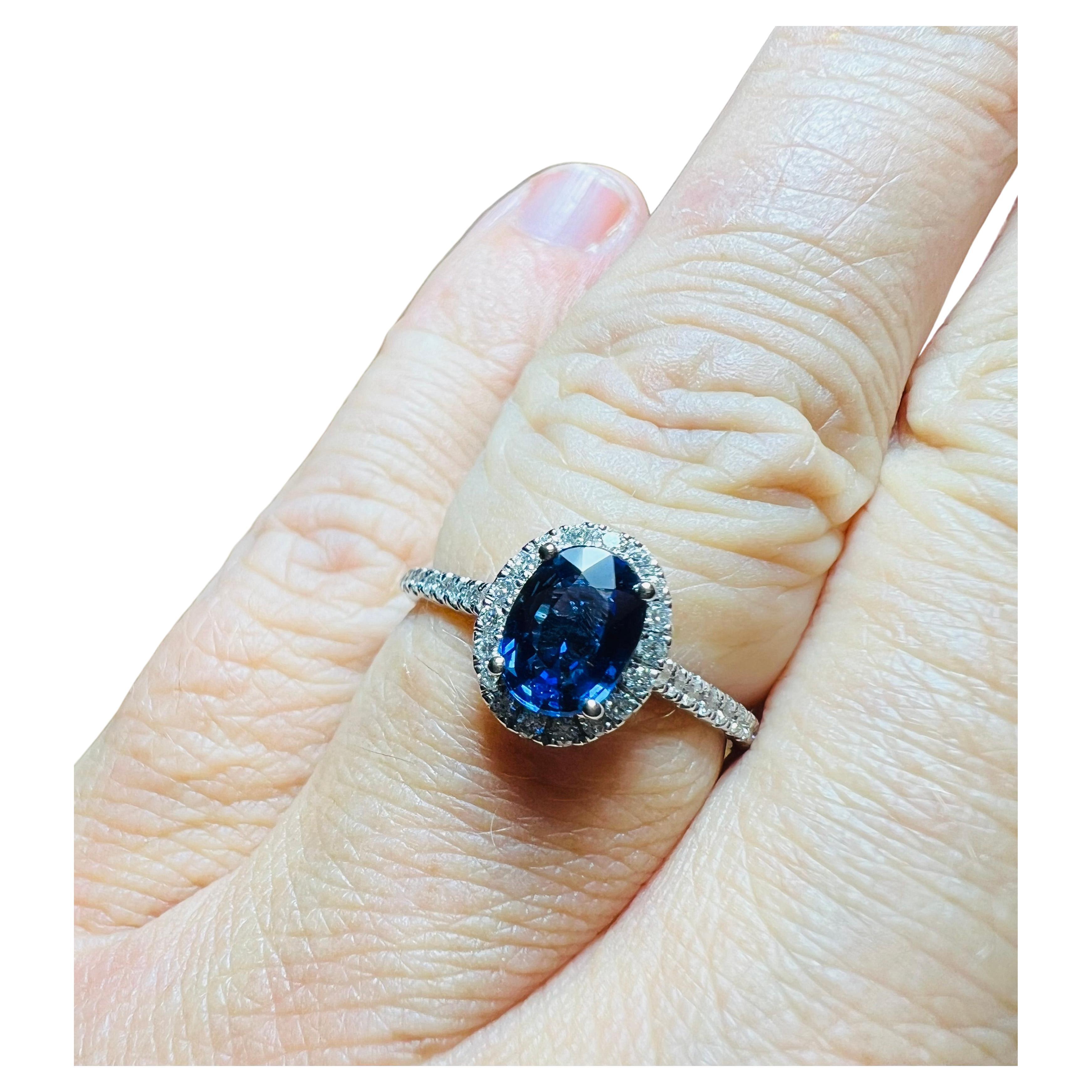 Ring Set With A Sapphire Surrounded By Diamonds, 18 Carat Gold