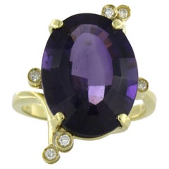 Ring with amethyst and brilliant cut diamond up to 0.20ct 4.6 grams 18k gold