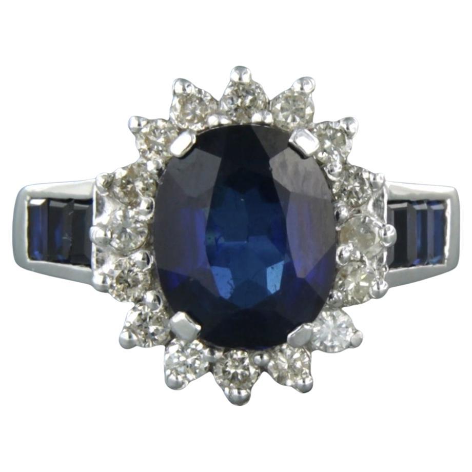 Ring set with sapphire and brilliant cut diamond 0.50 ct, 18k white gold