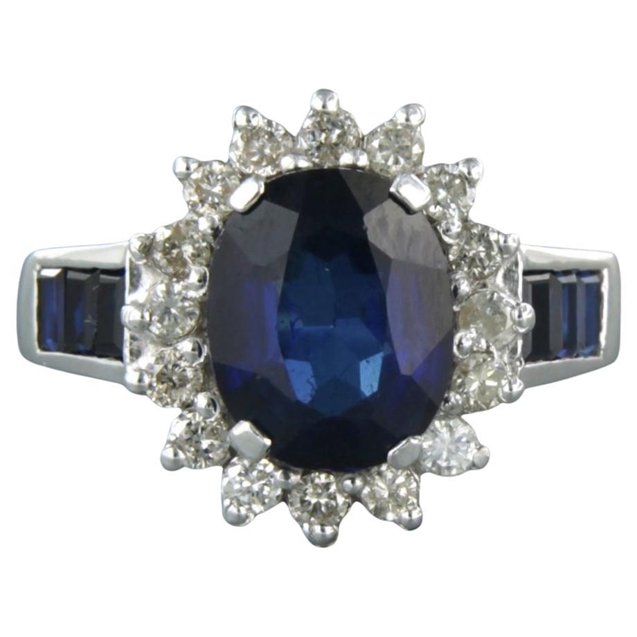 Bague sertie d'un saphir et d'un diamant taille brillant 0,50 ct, or blanc 18k