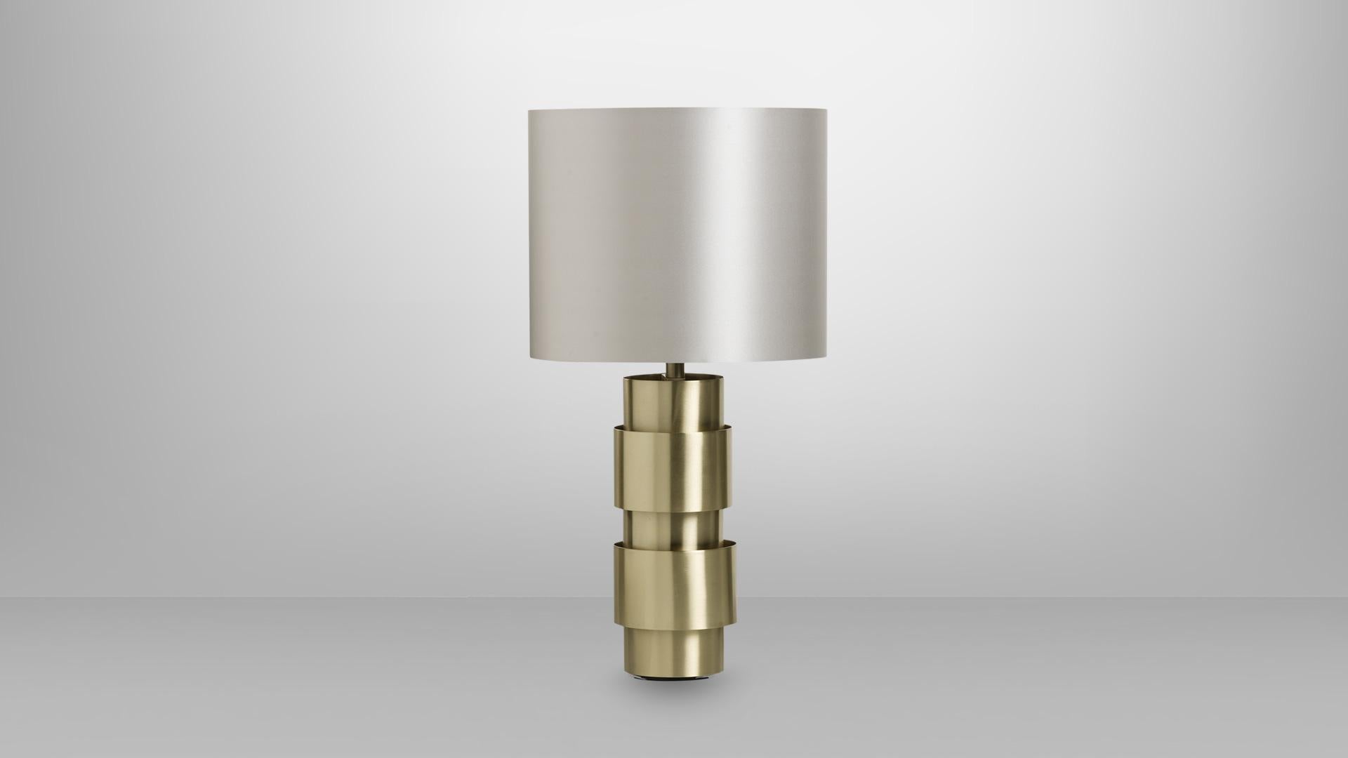 Ring table lamp by CTO Lighting.
Materials: bronze base with dove grey silk shade and silk diffuser.
Also available in satin brass base with dove grey silk shade and silk diffuser.
Dimensions: H 64 x W 30 cm.

All our lamps can be wired according to