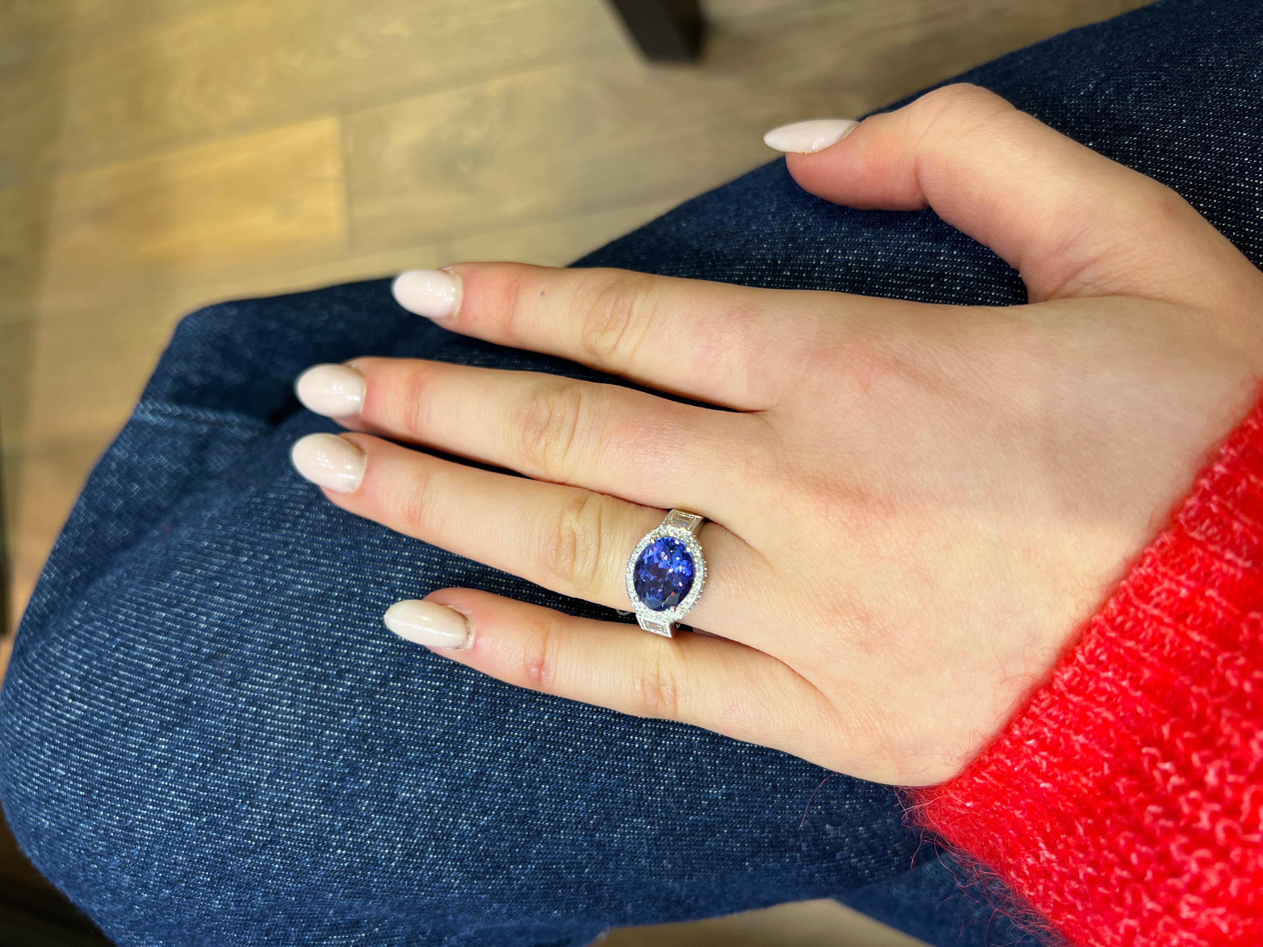 18K White Gold Ring with Oval Tanzanite and Diamond Accents

An exquisite 18K white gold ring featuring a mesmerizing oval-cut Tanzanite as the centerpiece, weighing an impressive 3.95 carats. This extraordinary gemstone showcases a deep, vivid