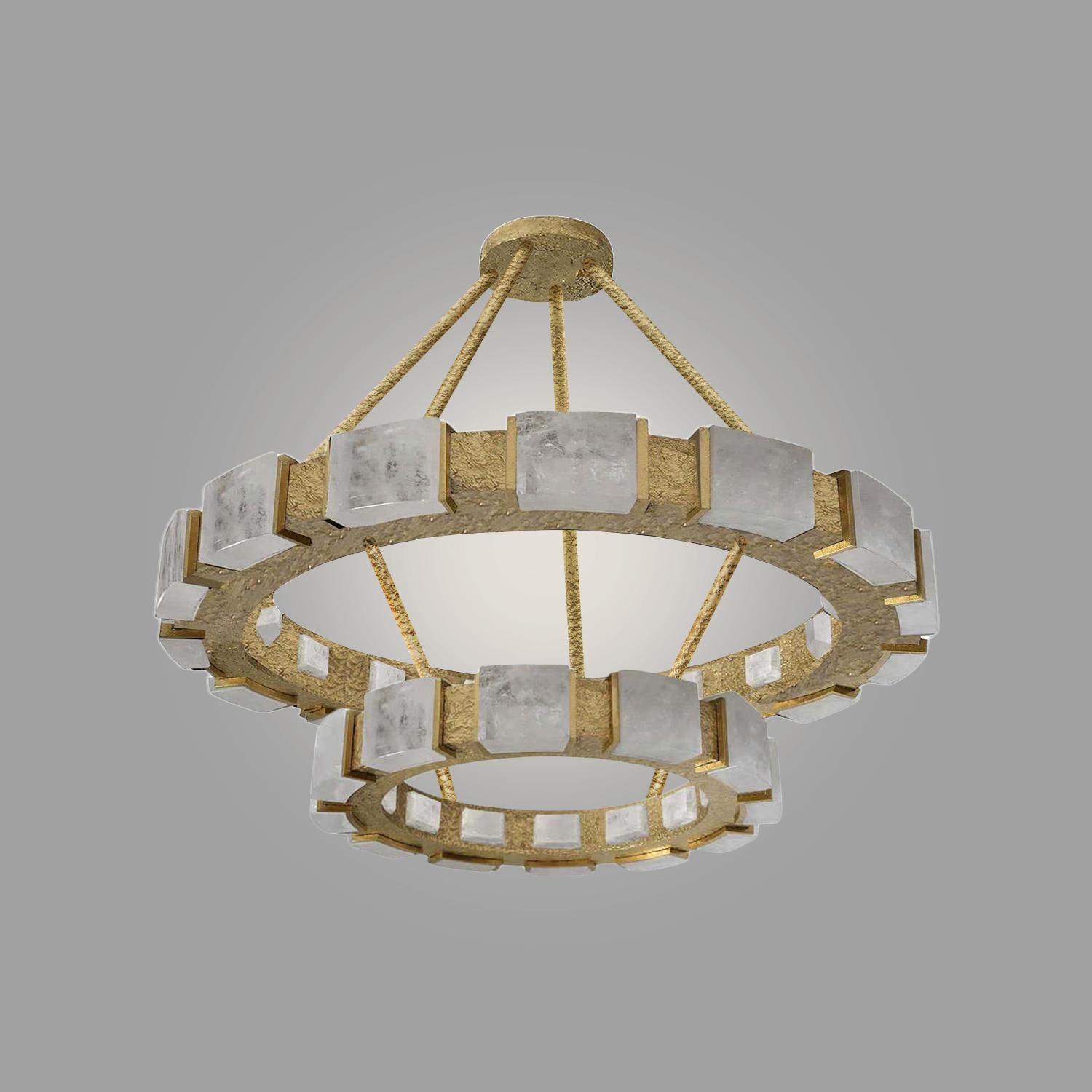 Two tiered rock crystal chandelier with hammered brass finish. 31” x 4” and 18” x 4”.

 Custom sizing and metal finish upon request. 

20 E12 sockets installed. Uses 60w/ea LED  lightbulbs. 

Created by Phoenix. 